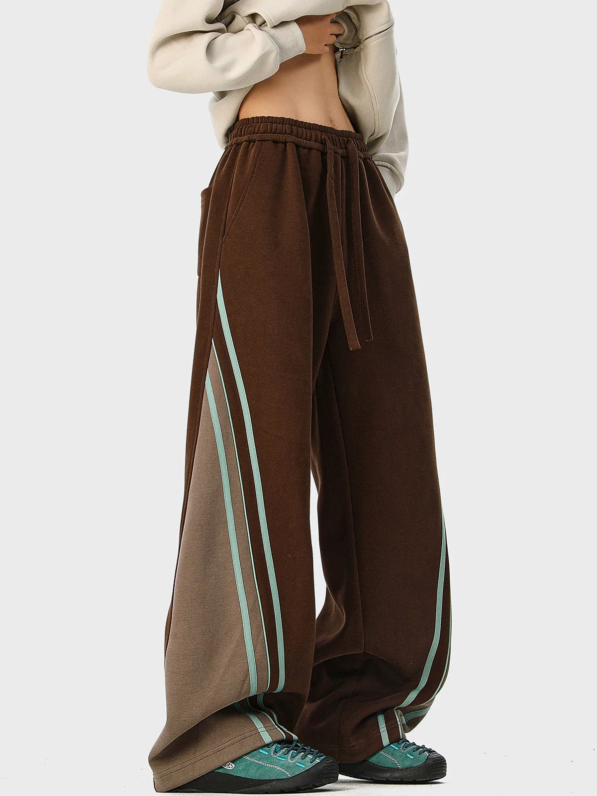 Mint stripe wide-leg track pants styled for modern streetwear