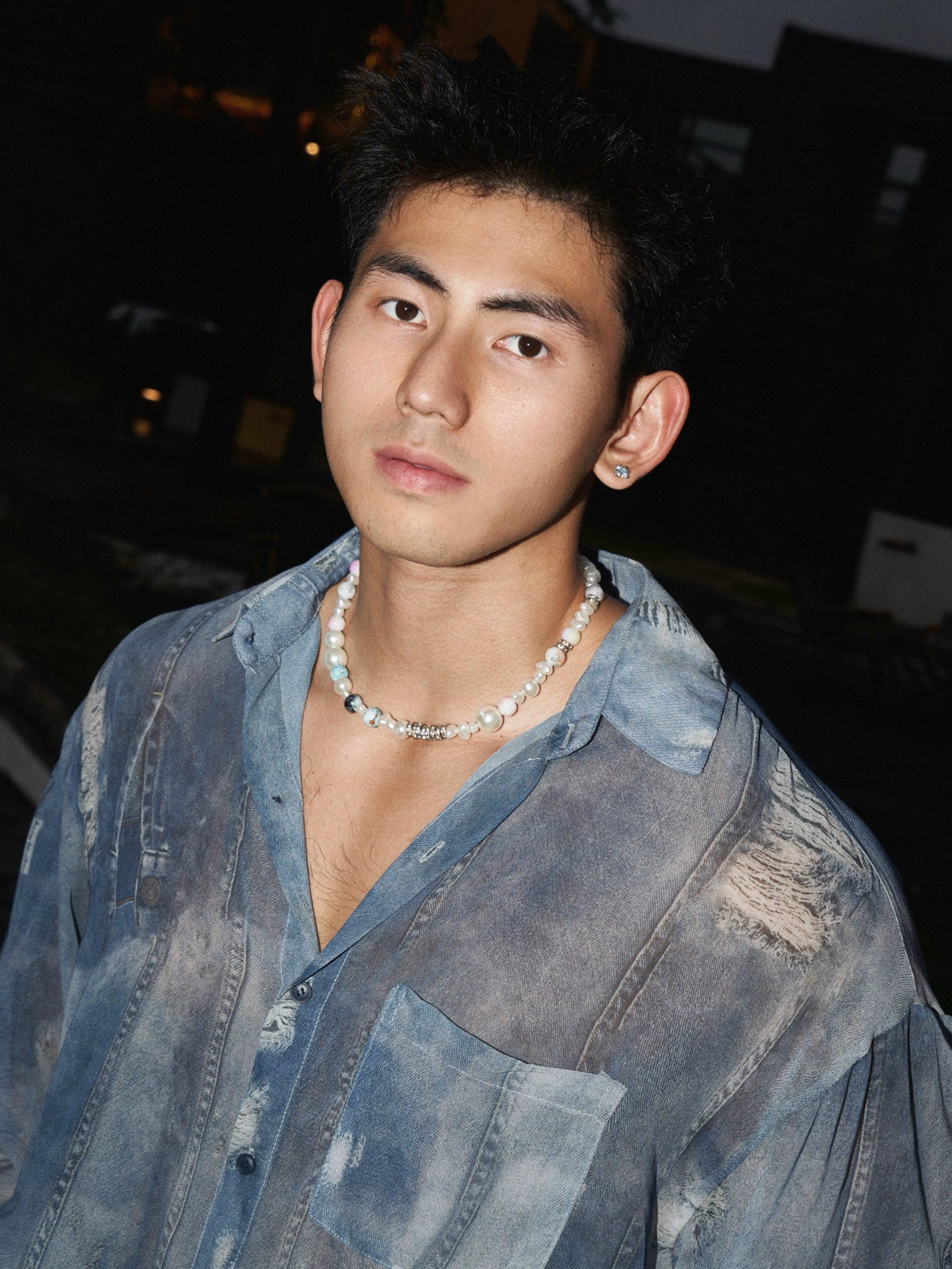 Distressed denim-style sheer button-up shirt styled as a lightweight layer
