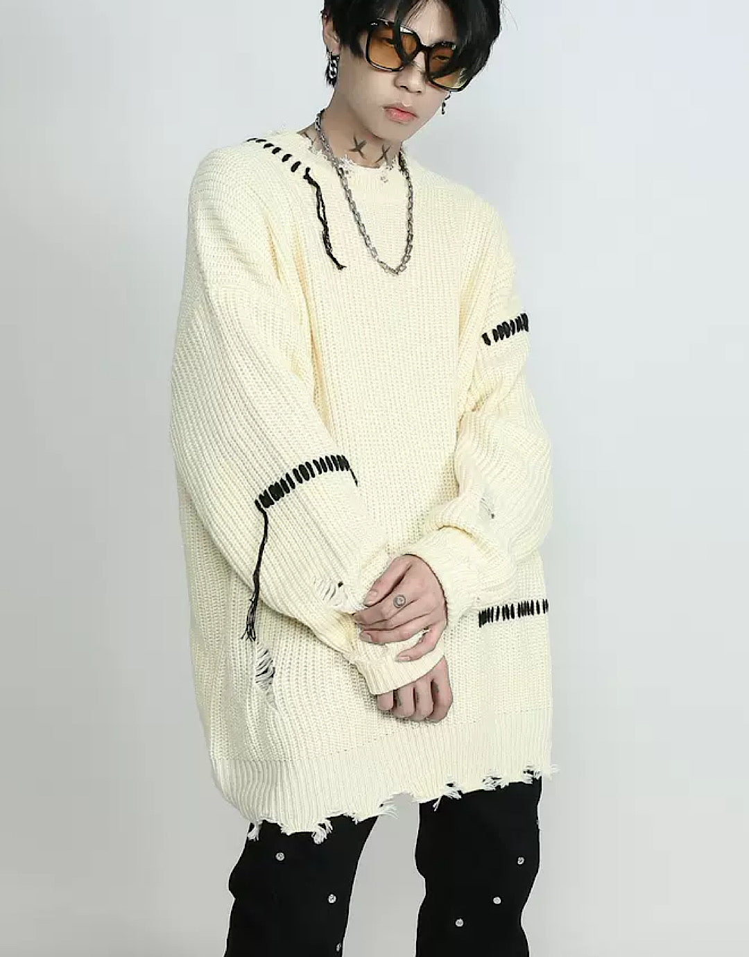 Pull cousu en détresse