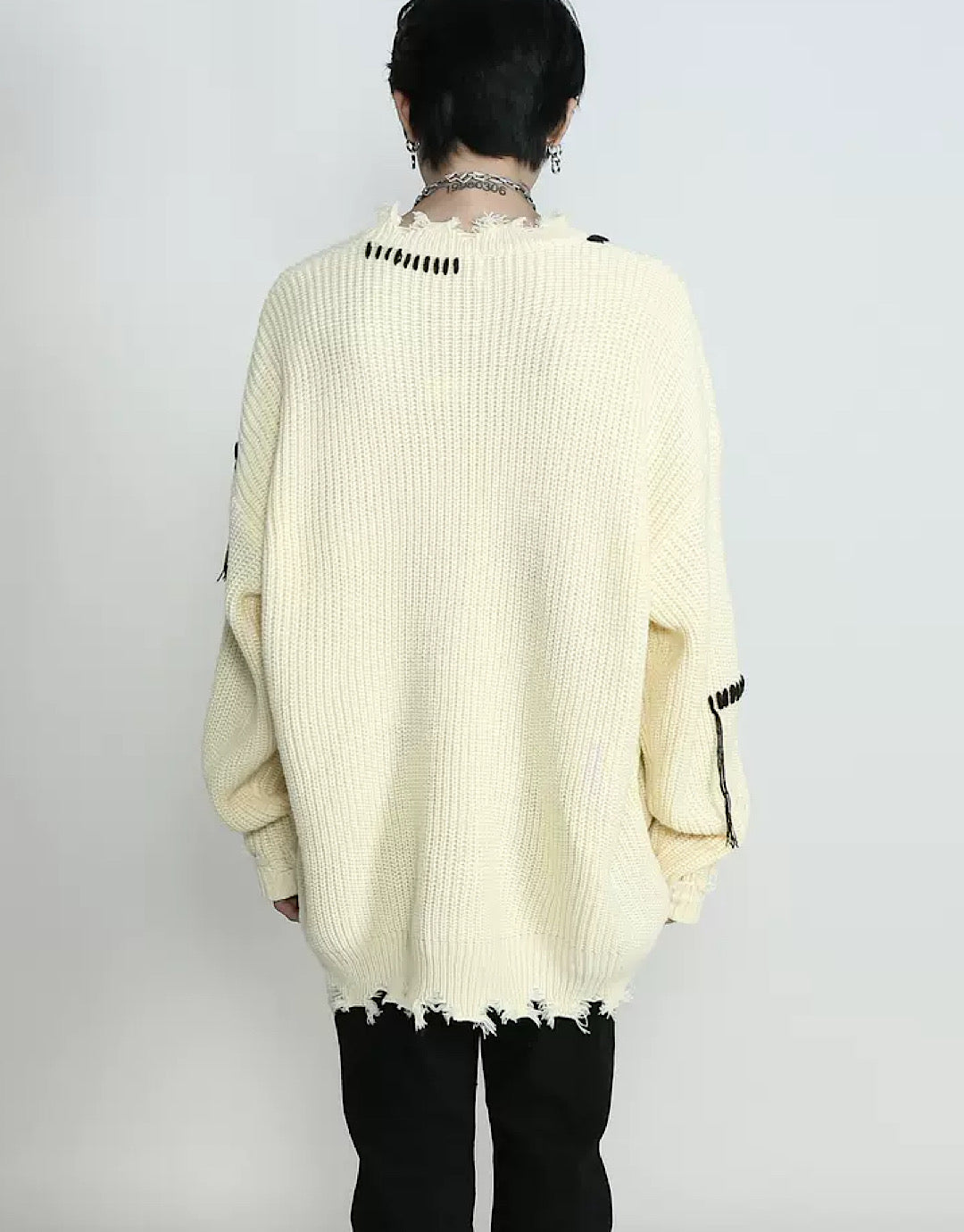 Pull cousu en détresse
