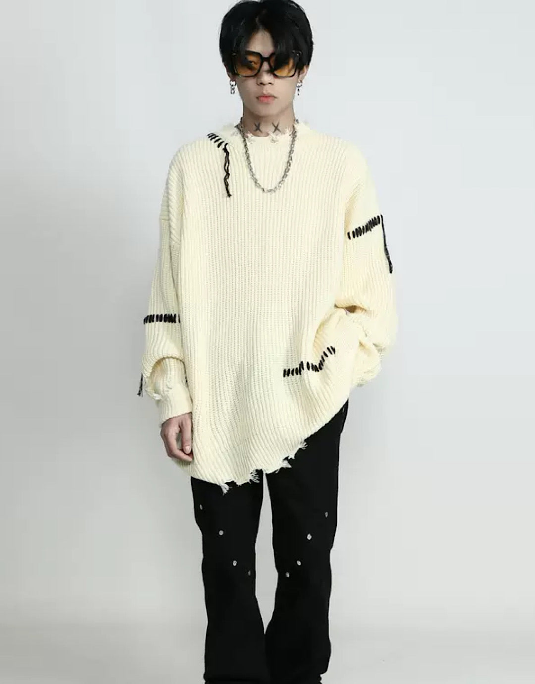 Pull cousu en détresse
