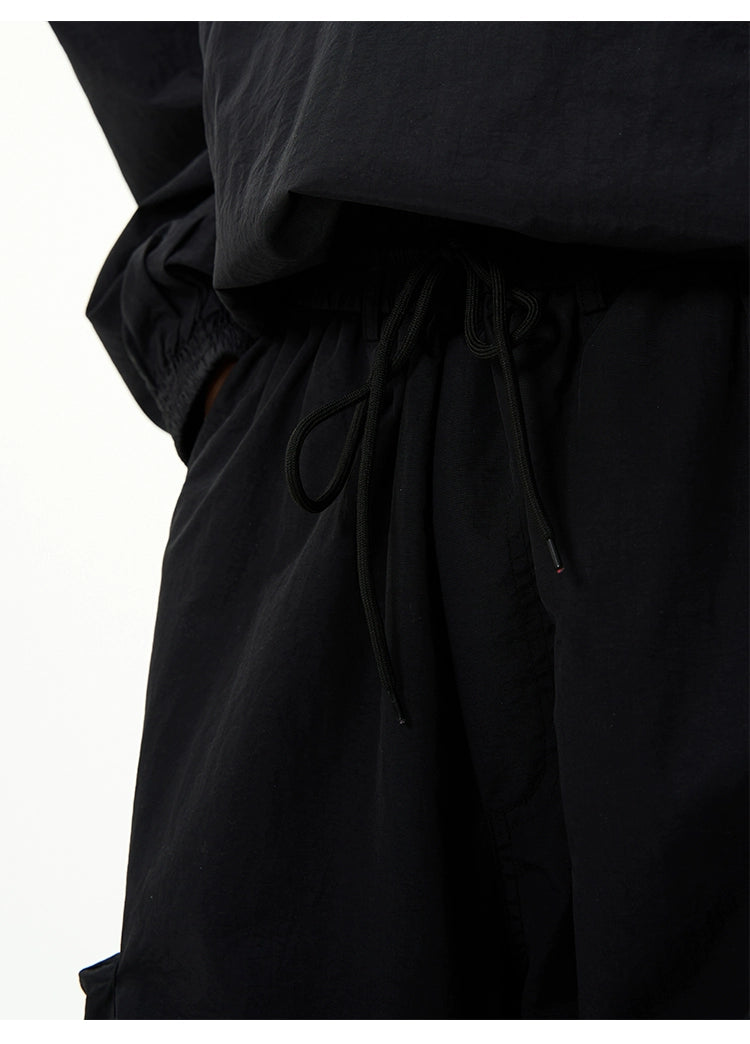 All-Black Oversized Windbreaker and Cargo Pants Setup