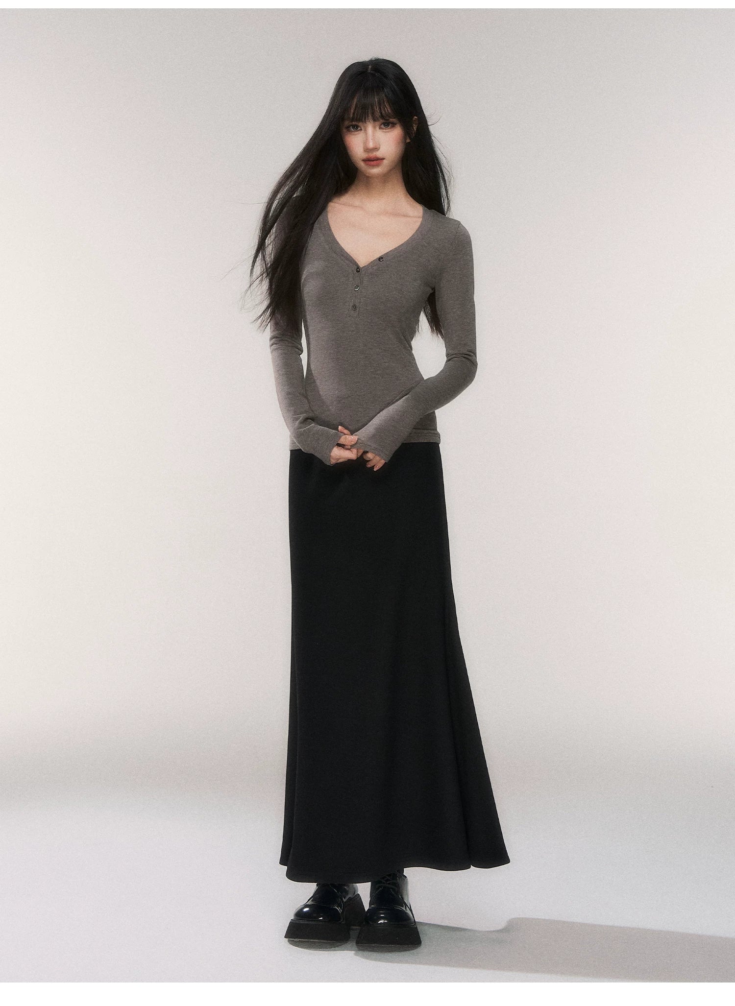 Noir Silhouette Buttoned V‑Neck Top
