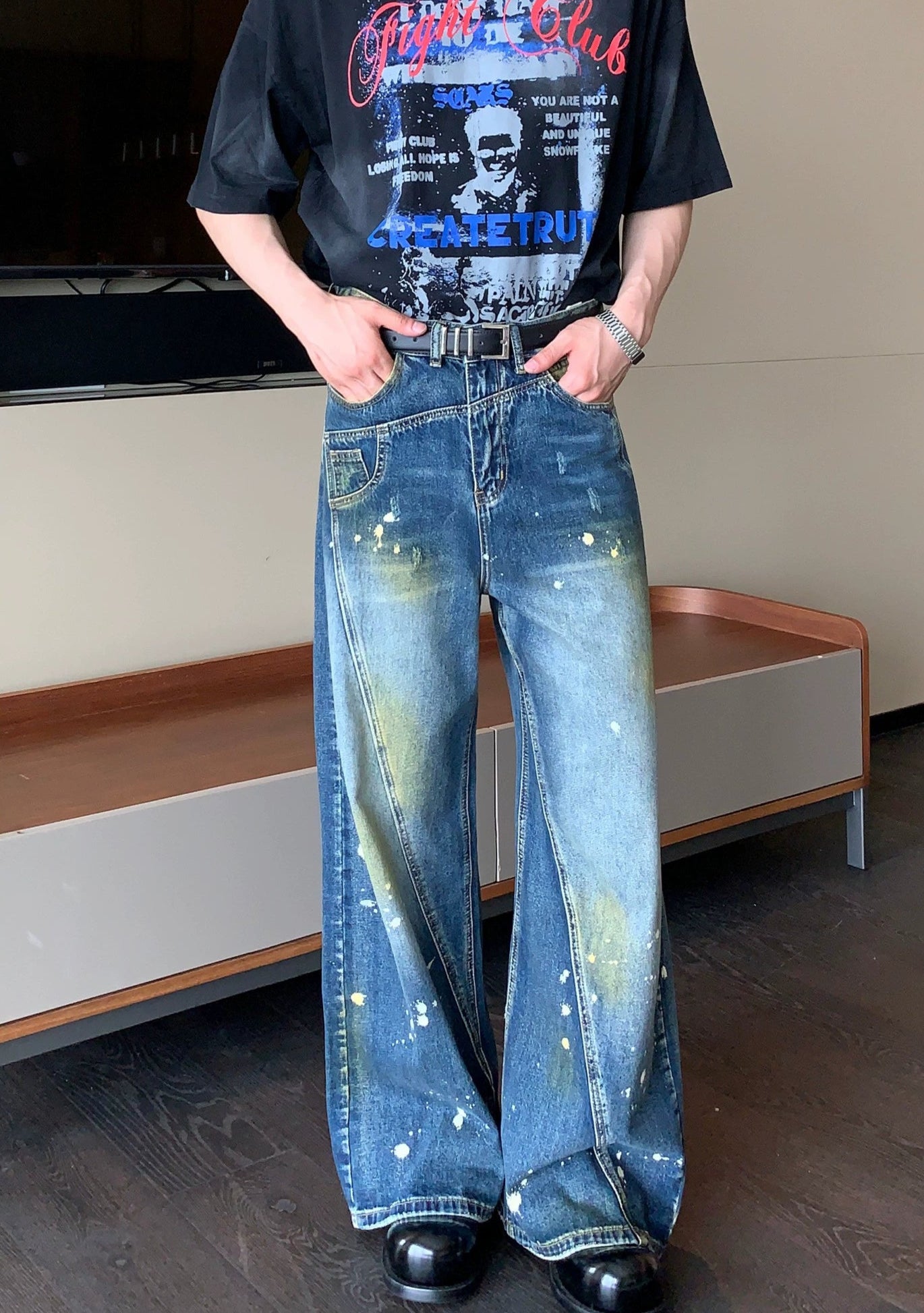 Wide-Leg Blue Jeans with Paint Splatter and Diagonal Seam Details
