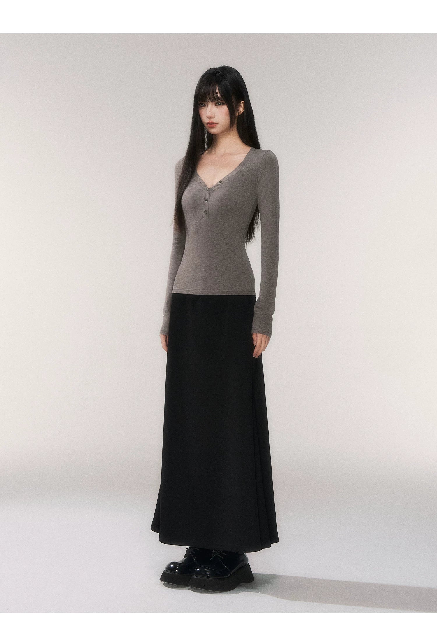Noir Silhouette Buttoned V‑Neck Top