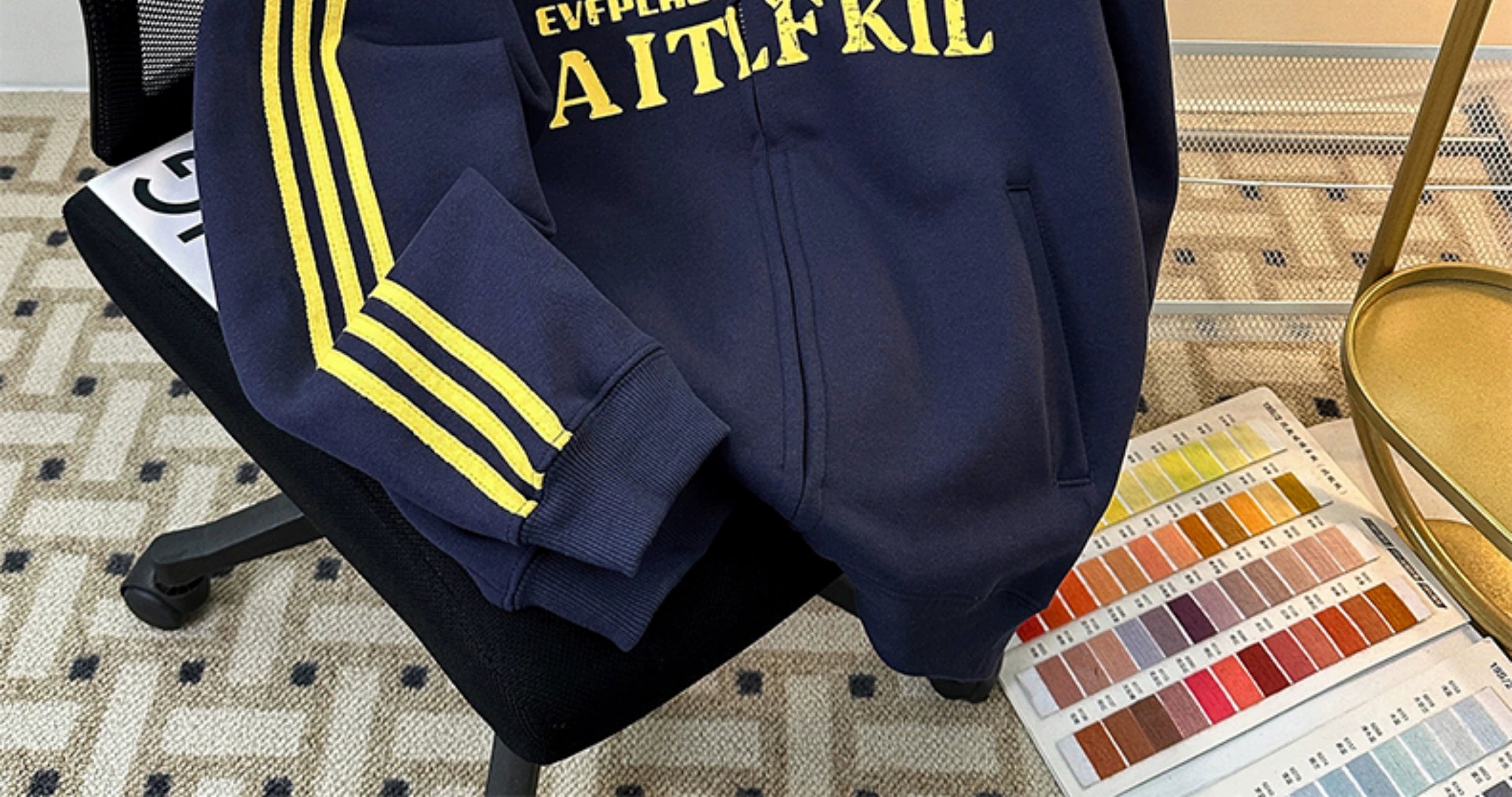 Black Track Jacket with Red Stripes and White Graphic Lettering