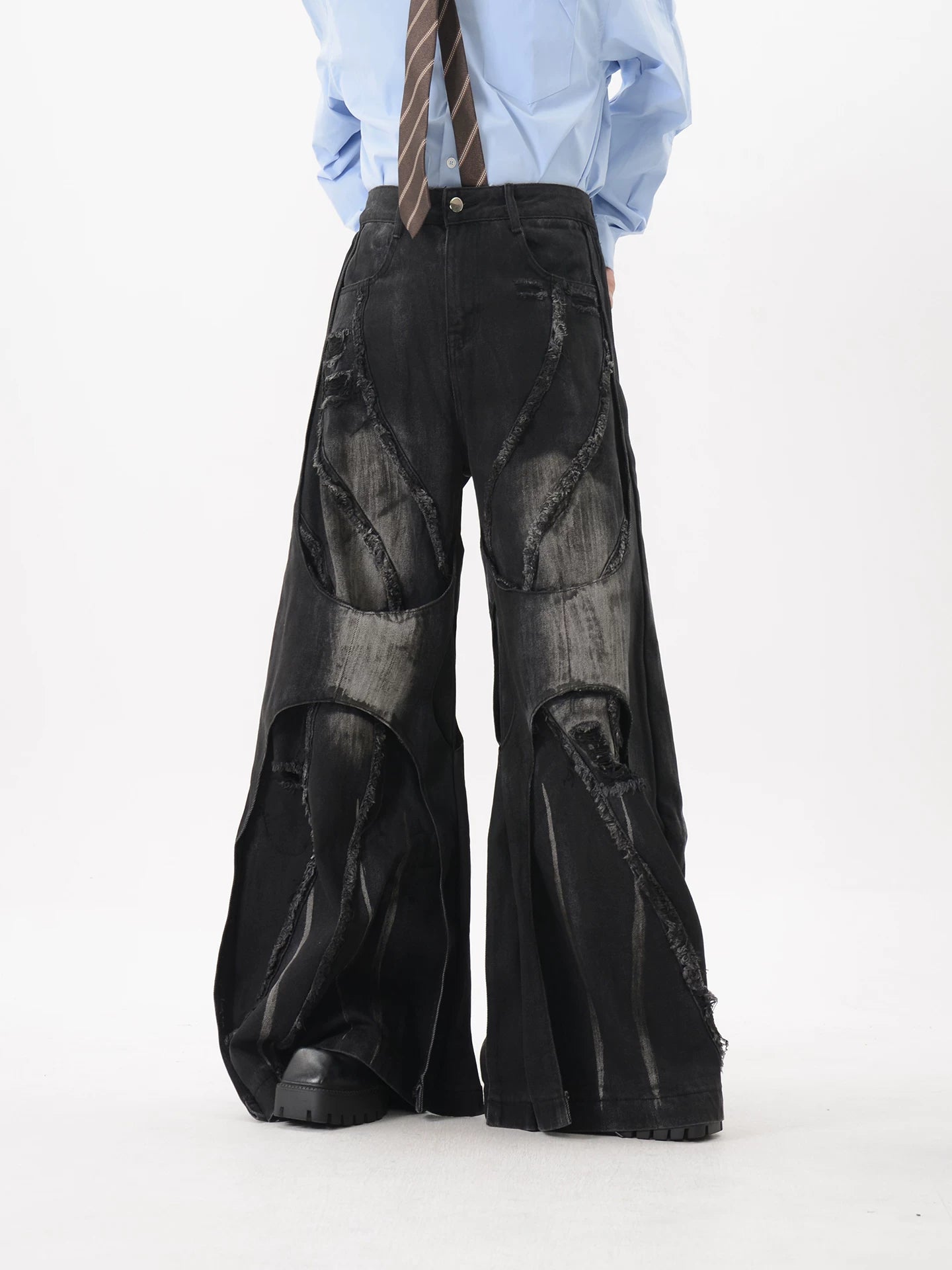 Obsidian Rift Shredded Wave Denim Trousers
