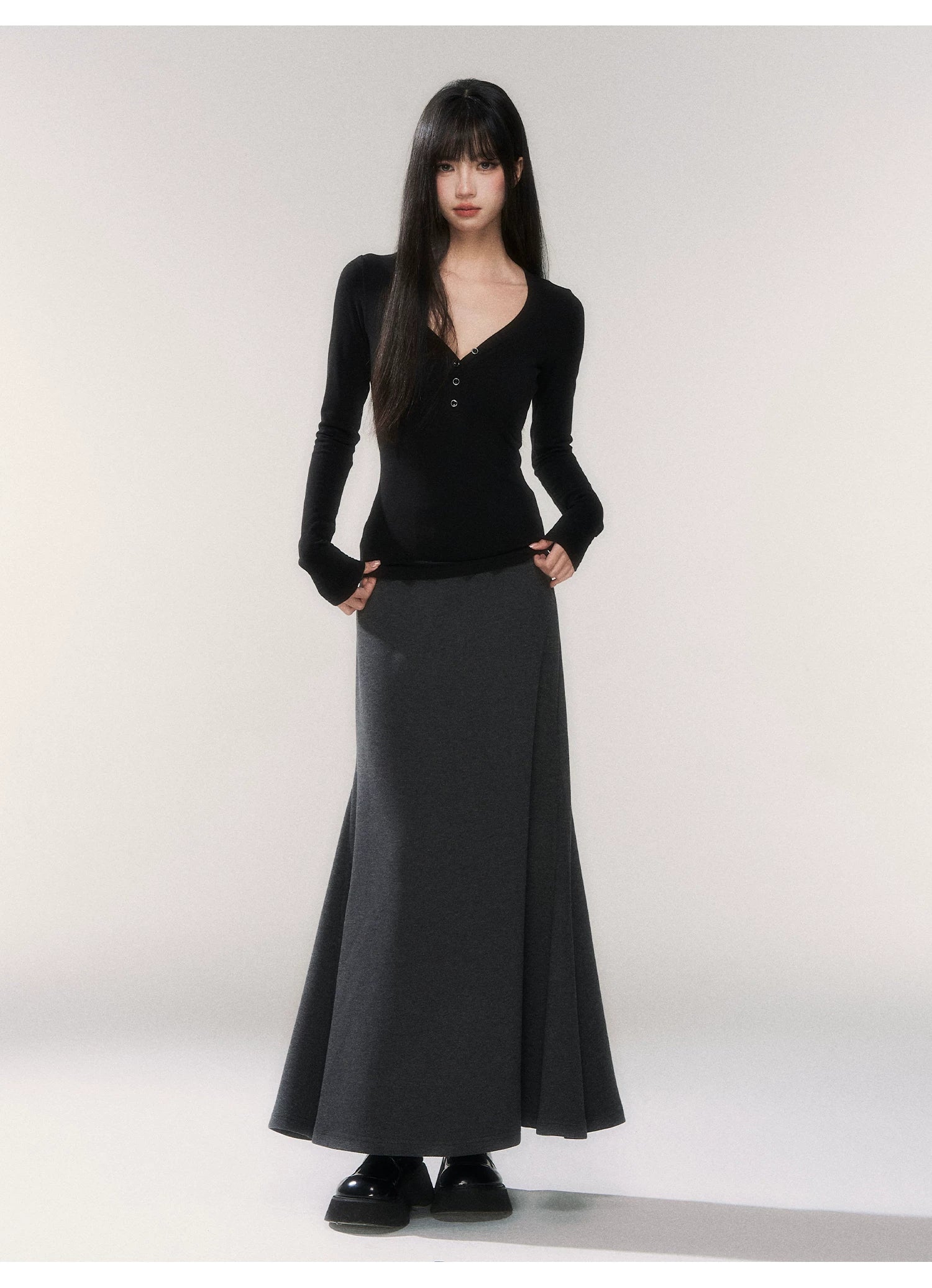 Noir Silhouette Buttoned V‑Neck Top