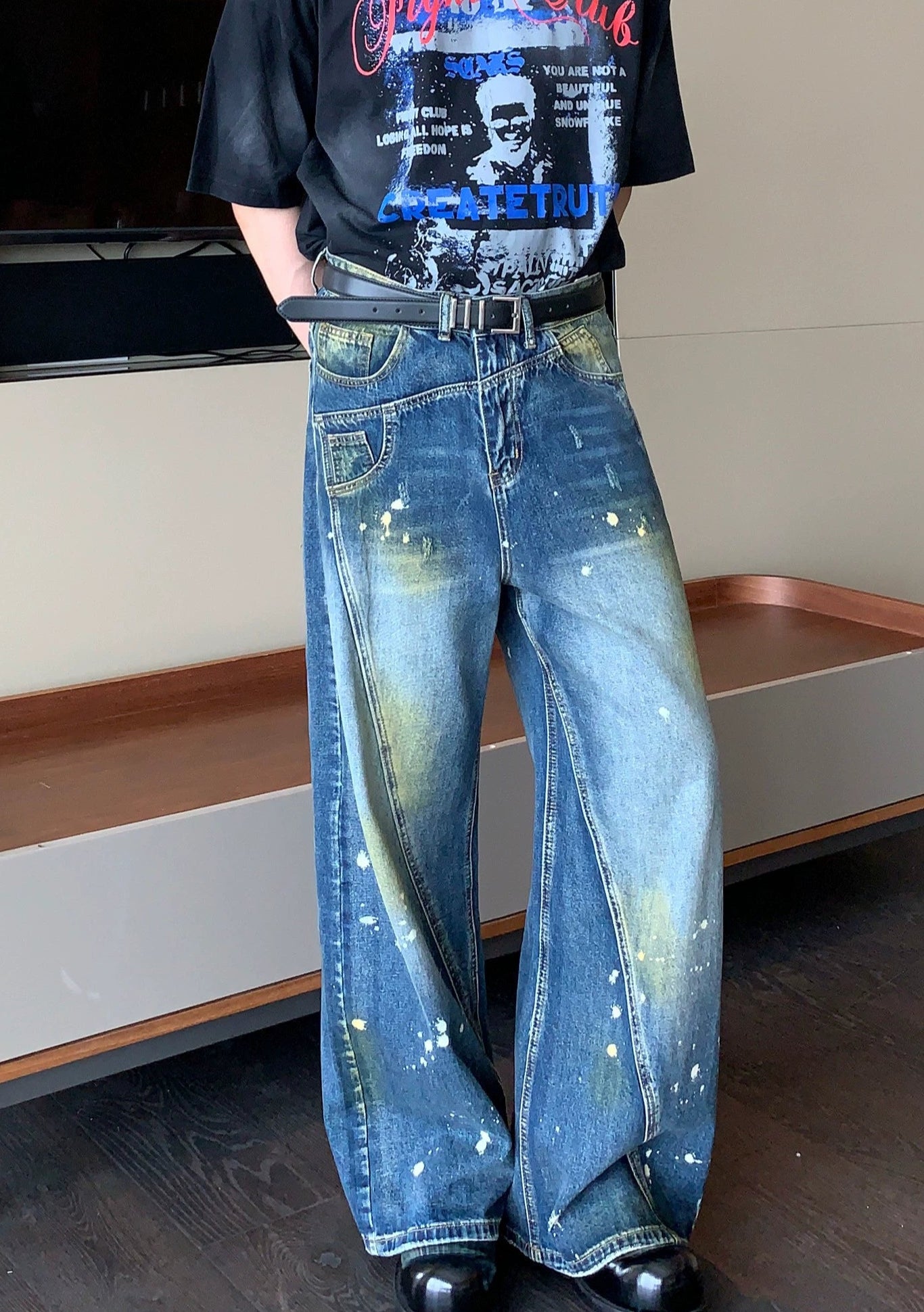 Wide-Leg Blue Jeans with Paint Splatter and Diagonal Seam Details
