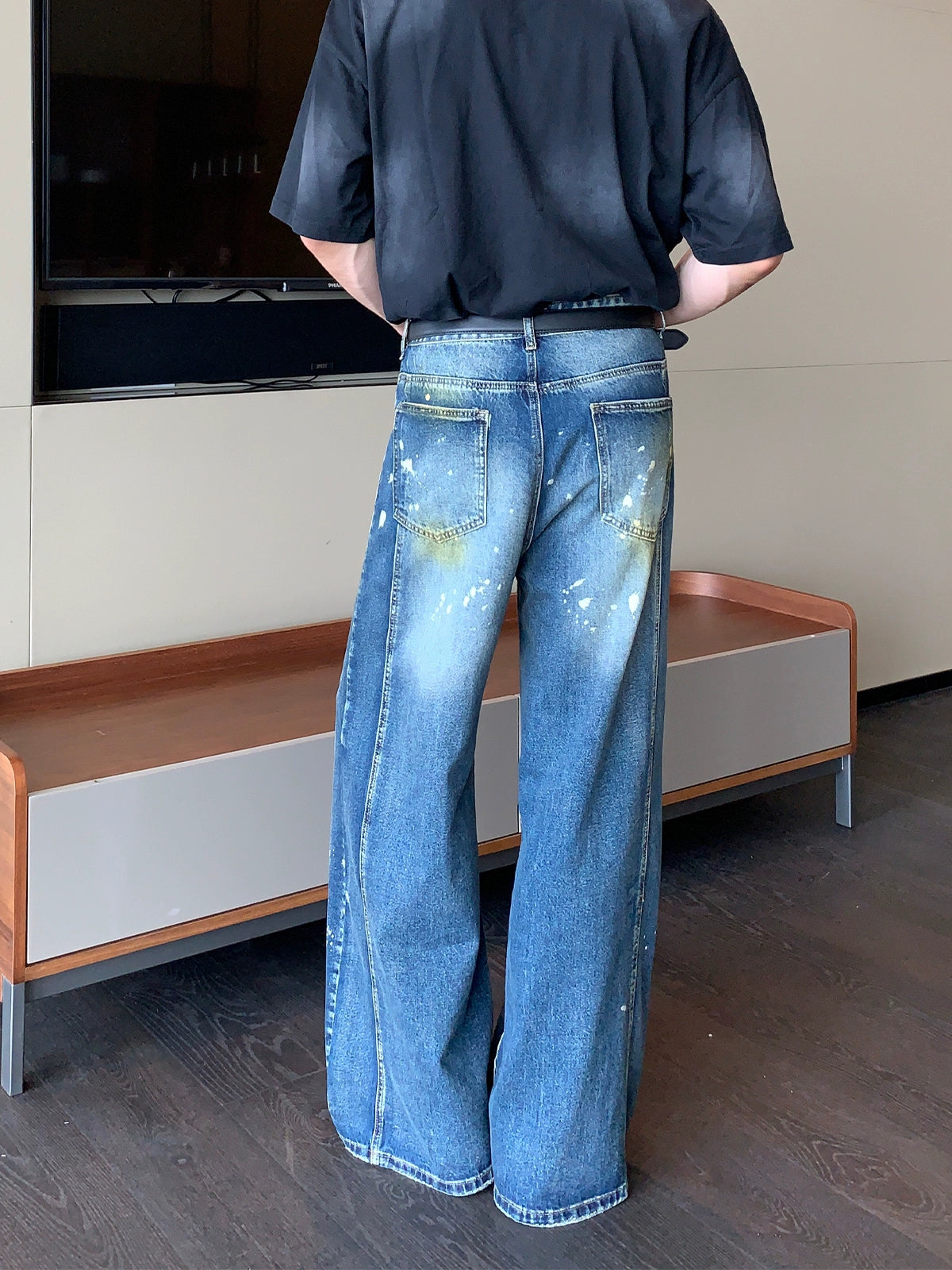 Wide-Leg Blue Jeans with Paint Splatter and Diagonal Seam Details
