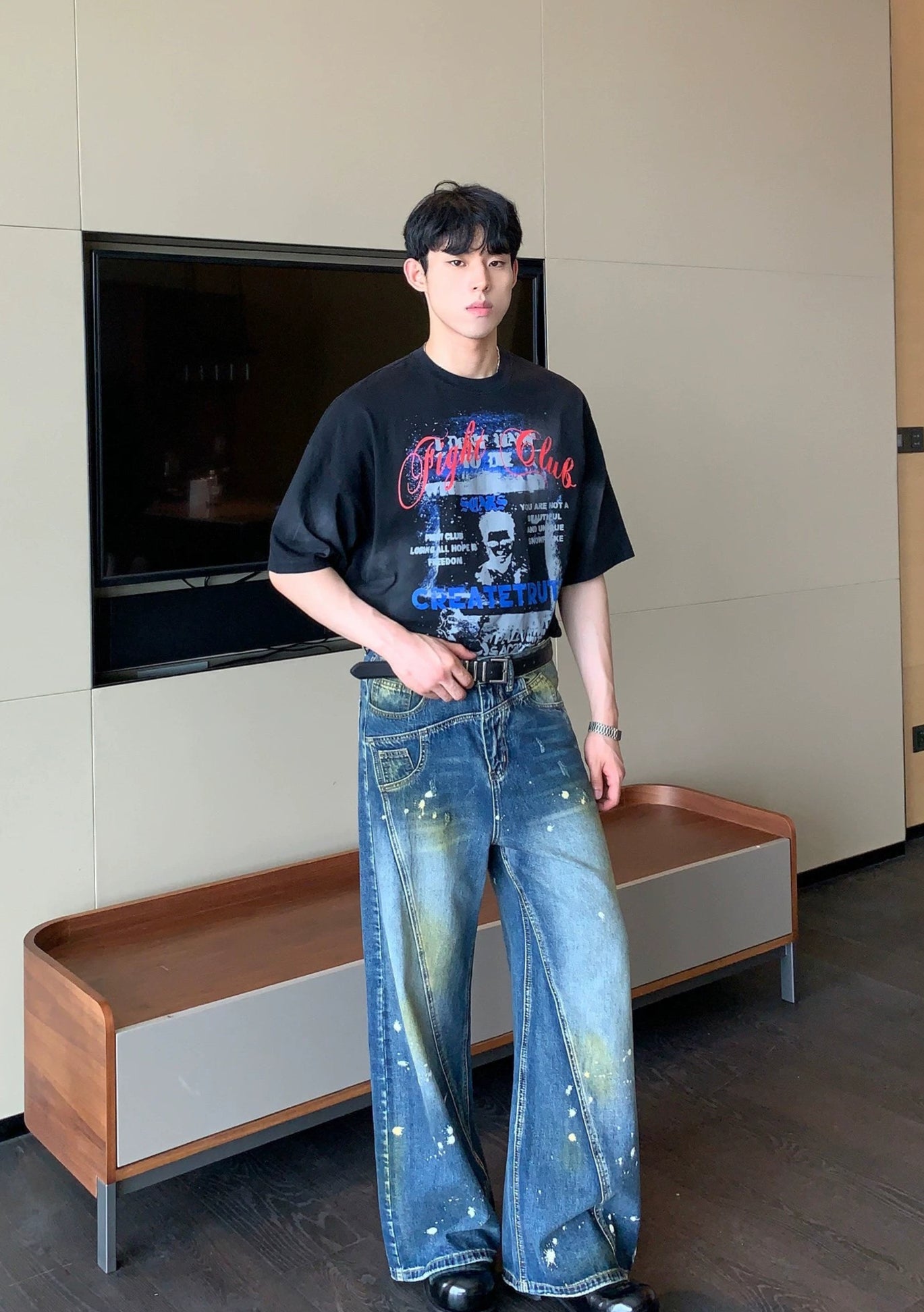 Wide-Leg Blue Jeans with Paint Splatter and Diagonal Seam Details