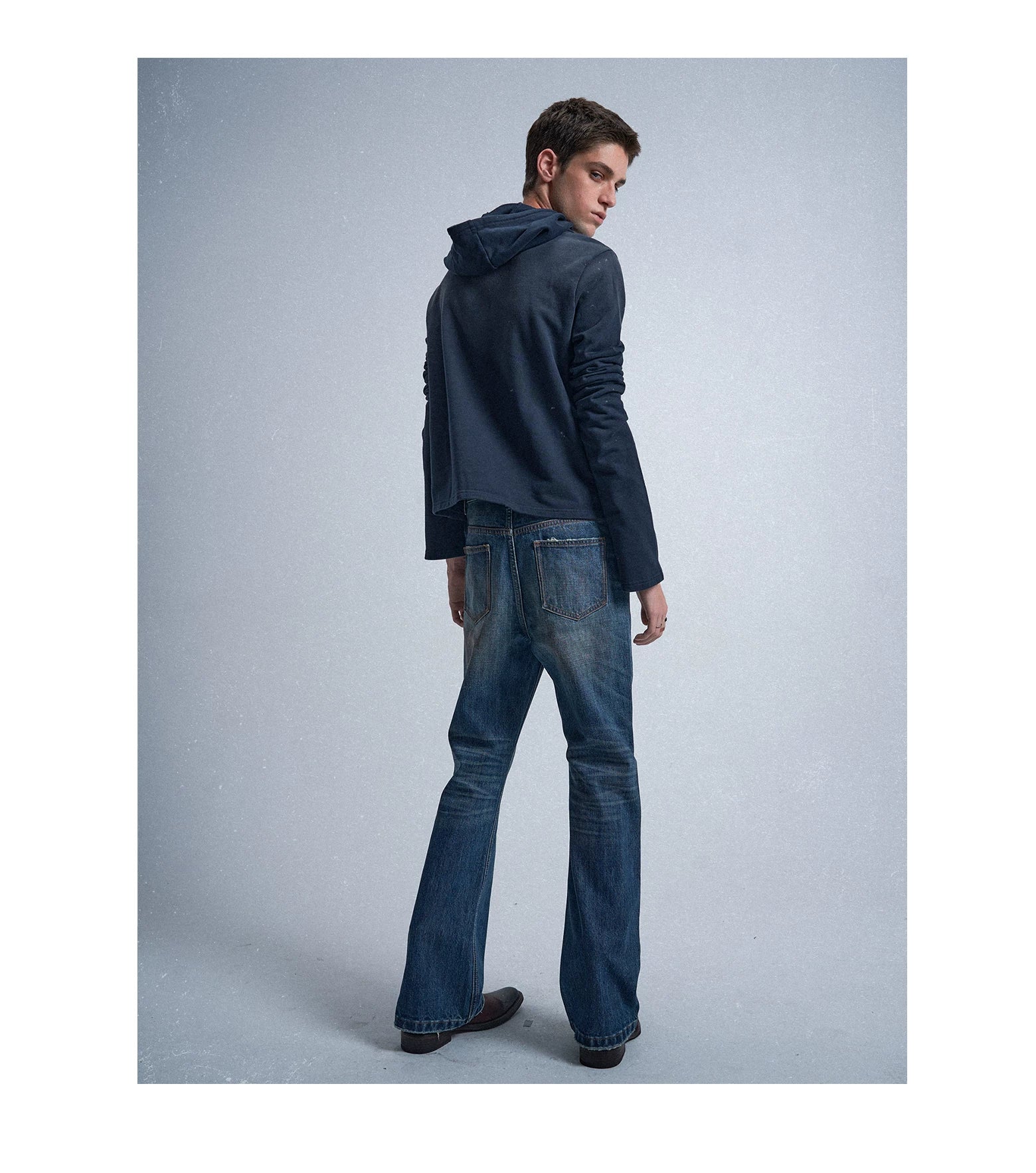 Rust‑Dyed Navy Distressed Bootcut Jeans