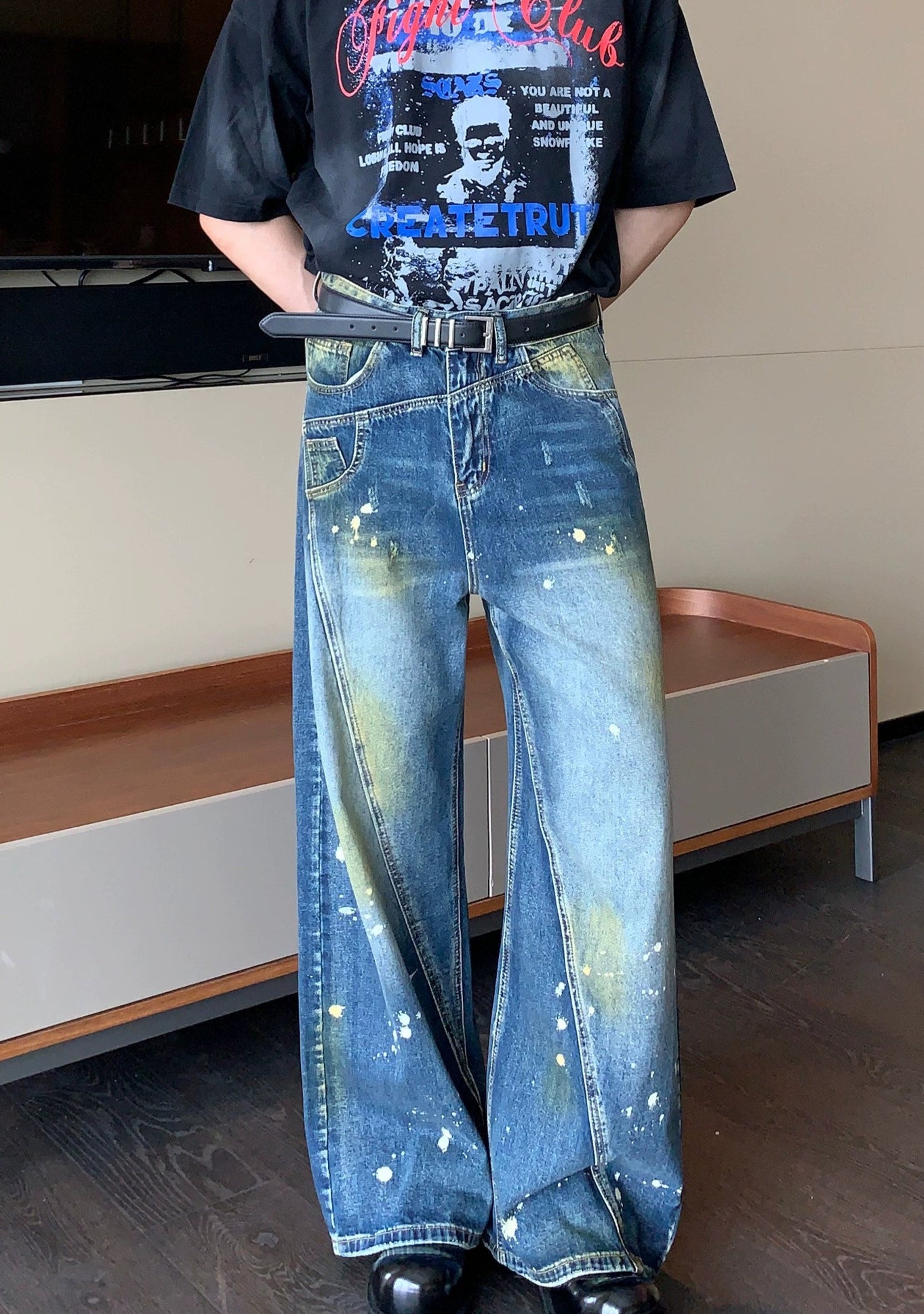 Wide-Leg Blue Jeans with Paint Splatter and Diagonal Seam Details