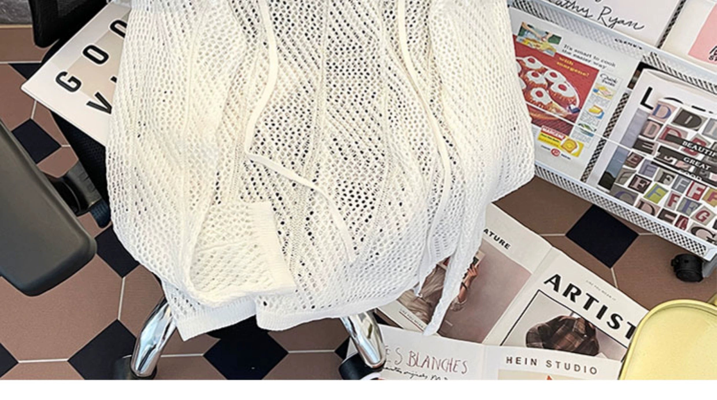 Oversized mesh knit sweater with a drawstring neckline
