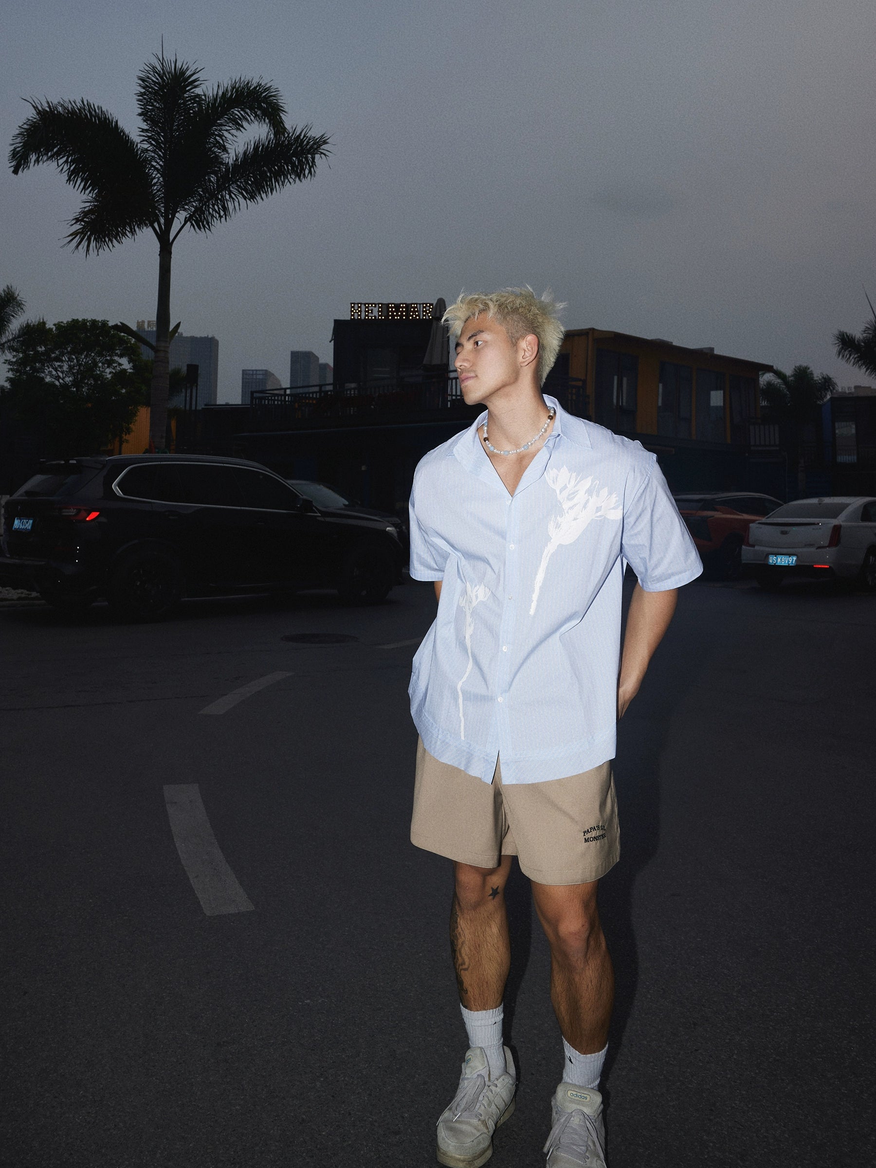 Light Blue Short-Sleeve Button-Up Shirt with White Floral Print