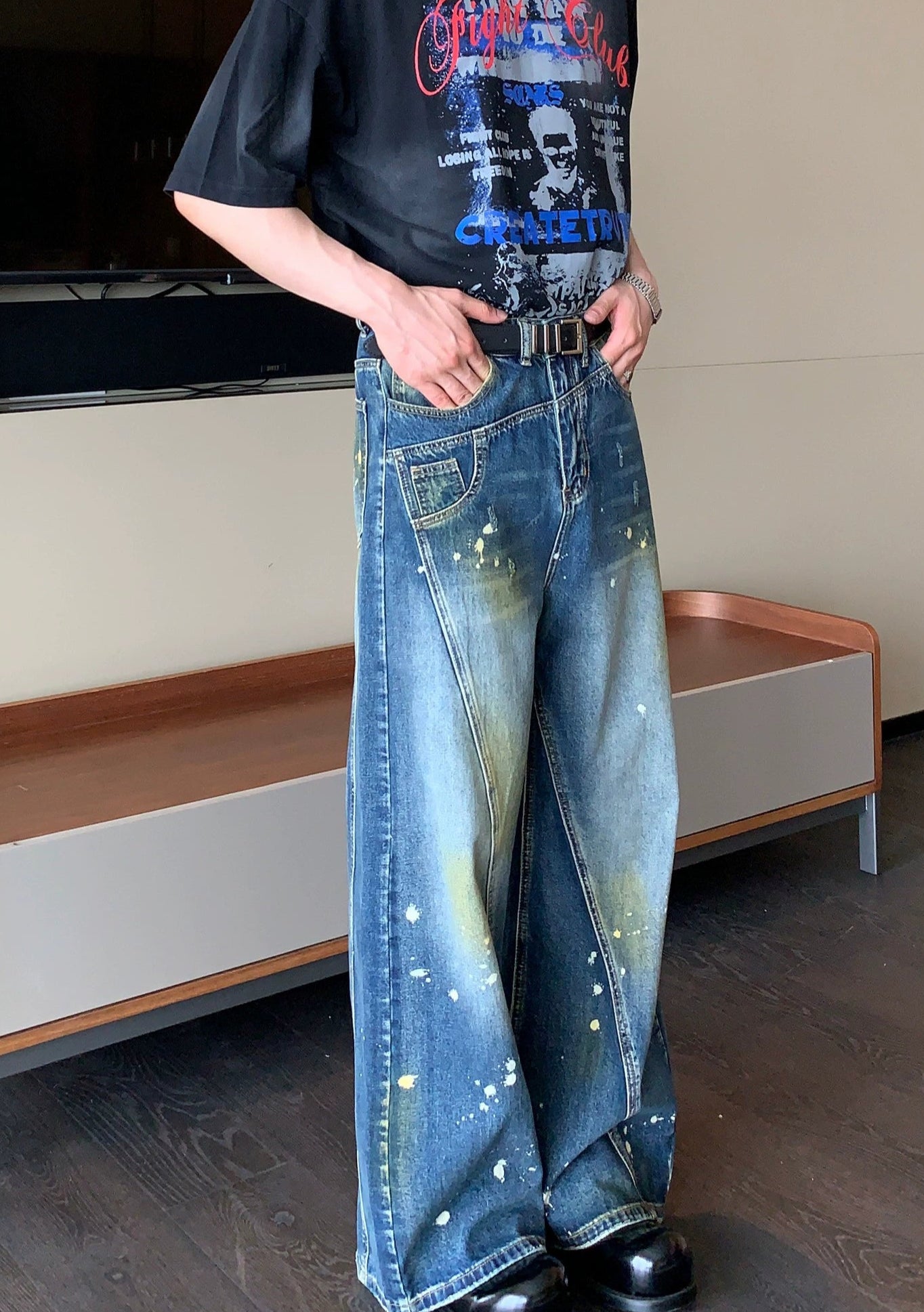 Wide-Leg Blue Jeans with Paint Splatter and Diagonal Seam Details