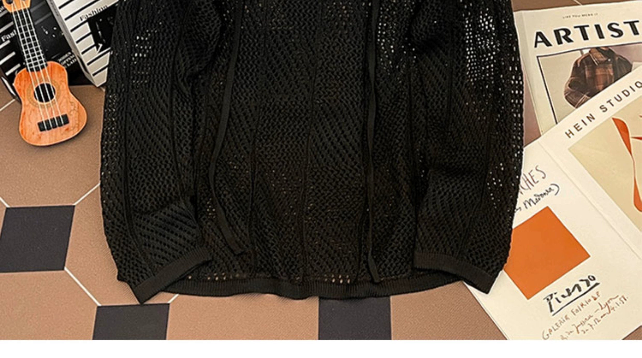 Oversized mesh knit sweater with a drawstring neckline