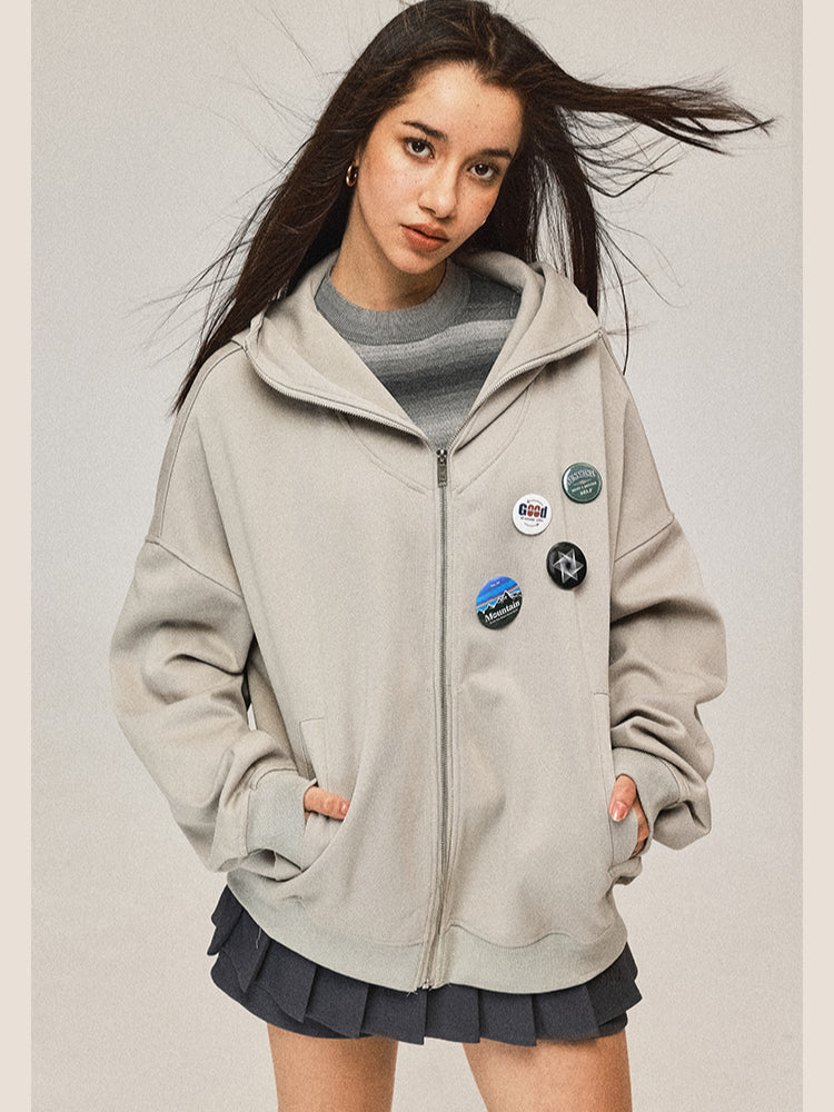 Manteau gris à capuche zippé