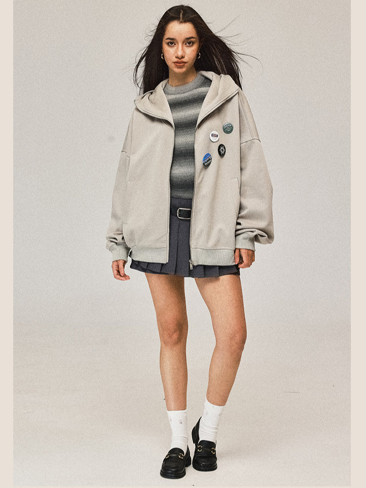 Manteau gris à capuche zippé
