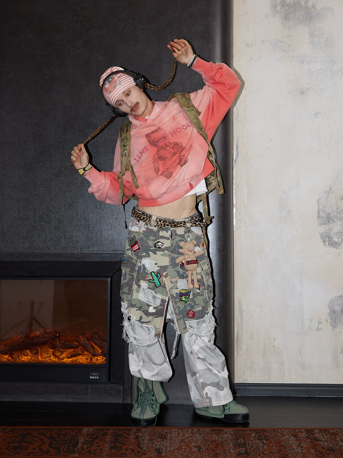 Distressed patchwork camouflage cargo pants styled look