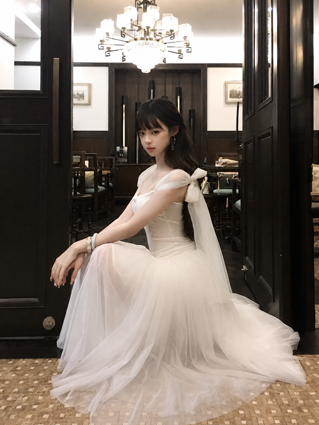 Off-white draped multi-way off-shoulder top, seated front view