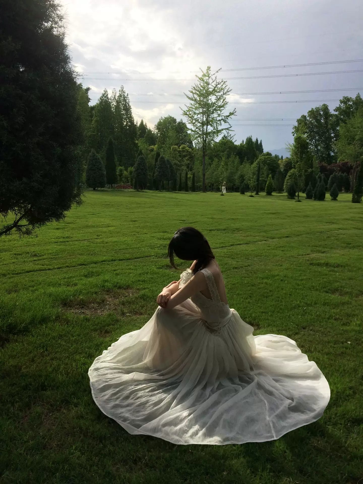 Ivory lace open-back maxi dress with full flowing skirt