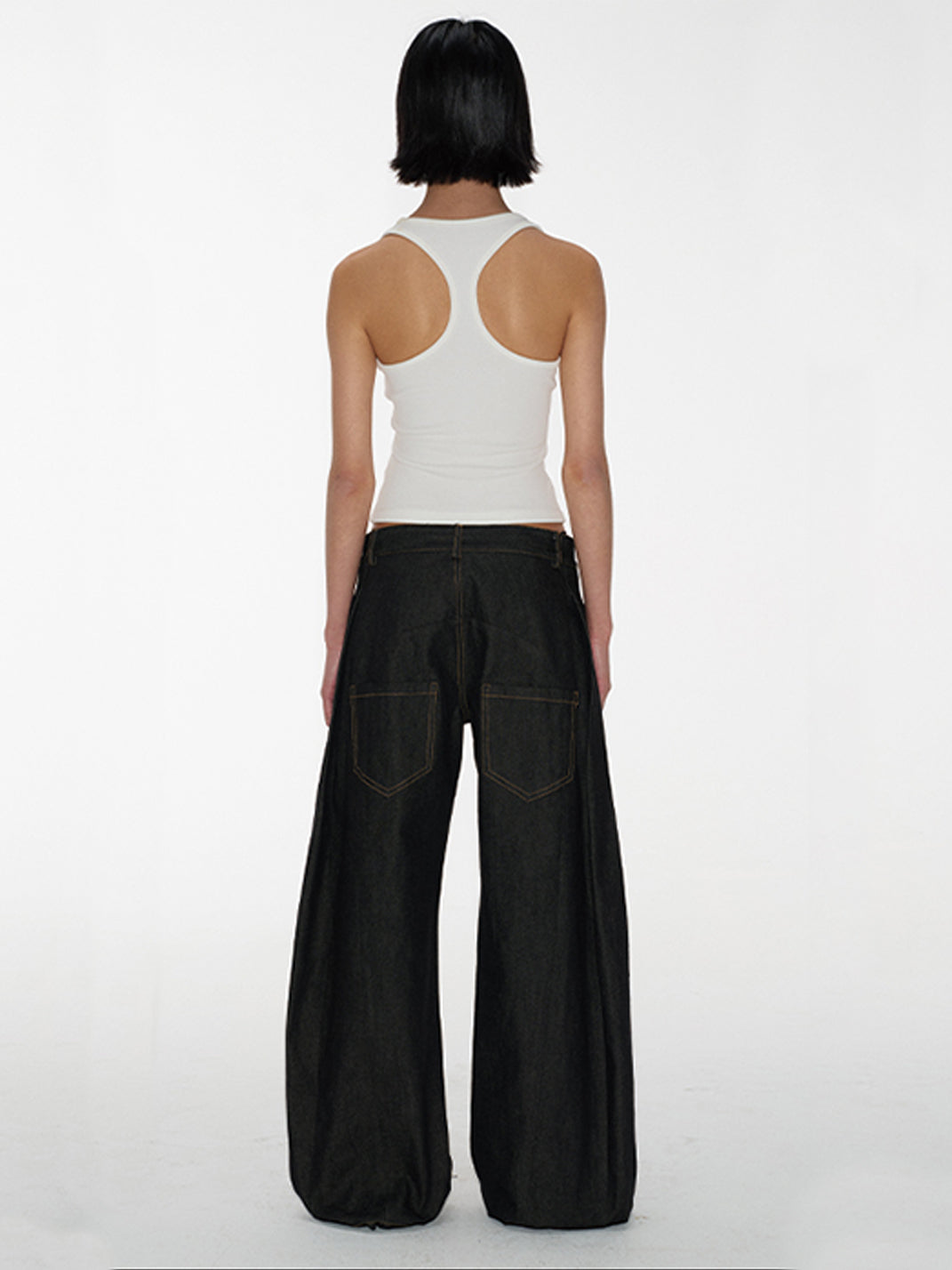 Low-Rise Curved Raw Denim Jeans