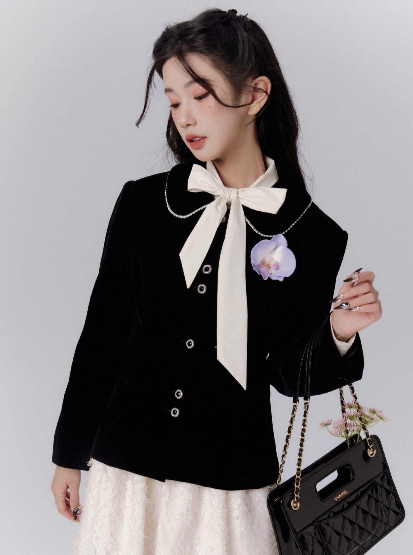 Elegant Black Fitted Blazer with Floral Brooch