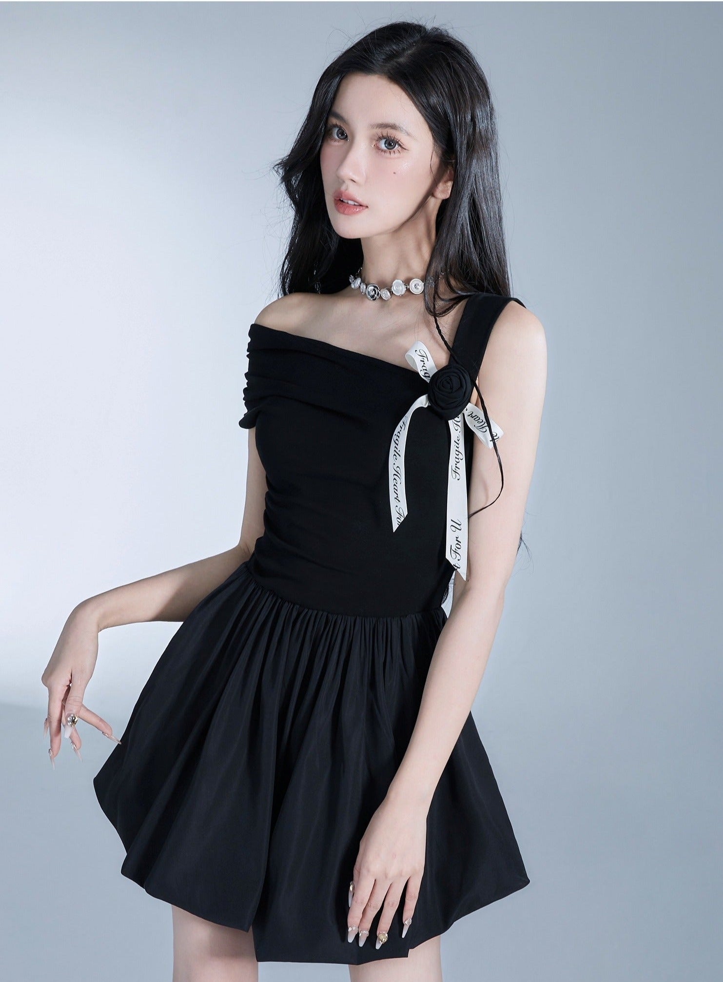 Elegant Off-Shoulder Black Mini Dress with Contrast Bow Detail