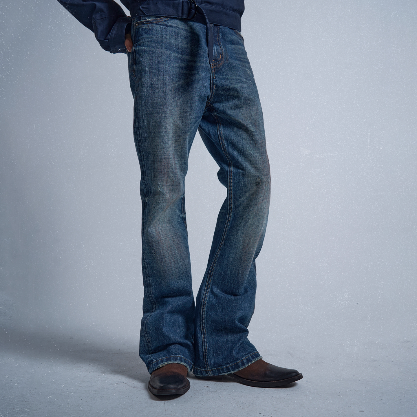 Rust‑Dyed Navy Distressed Bootcut Jeans