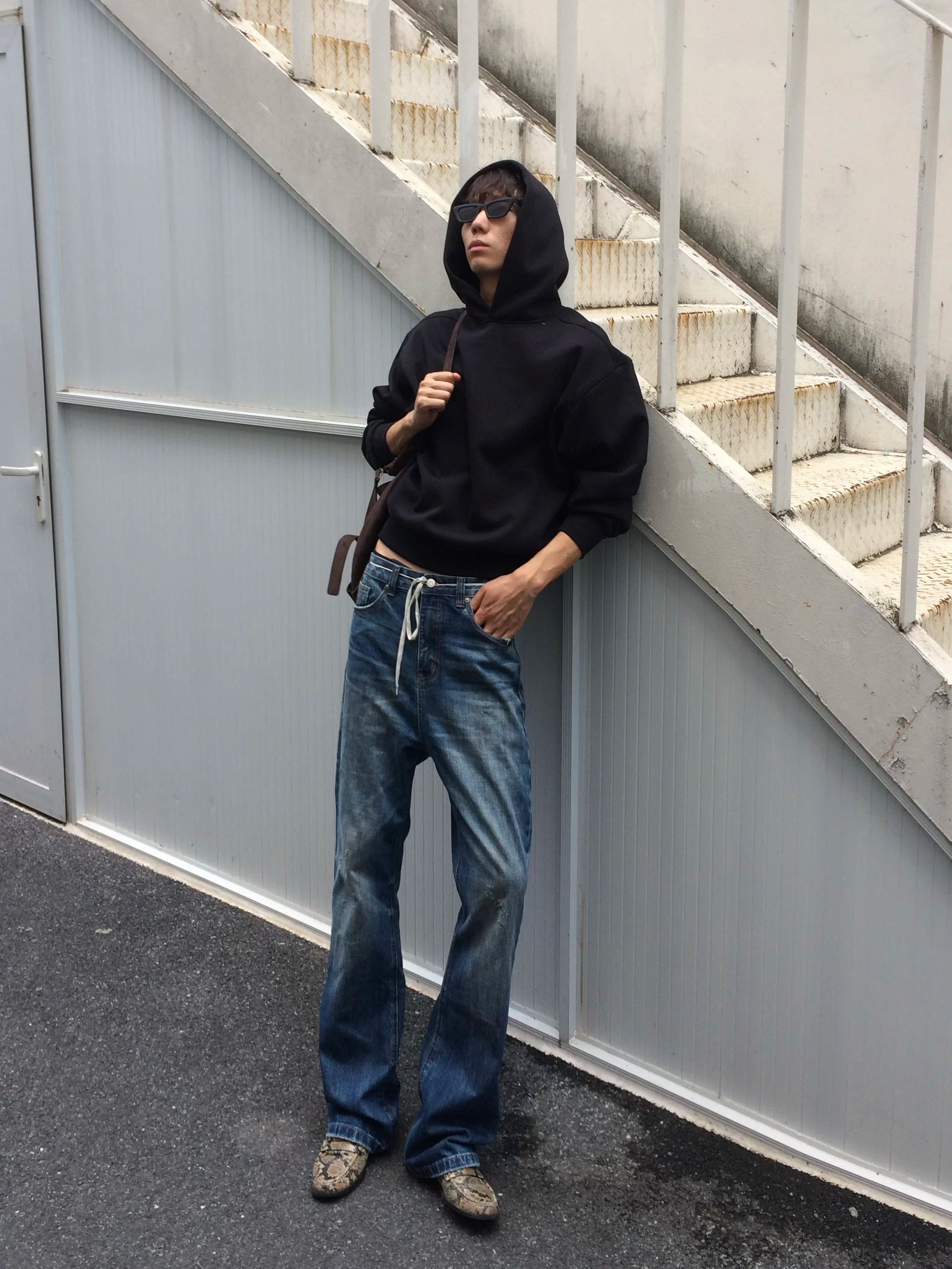 Rust‑Dyed Navy Distressed Bootcut Jeans