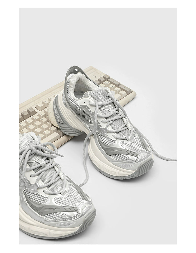 Chunky Futuristic Sneakers with Mesh Panels and Crisscross Detailing