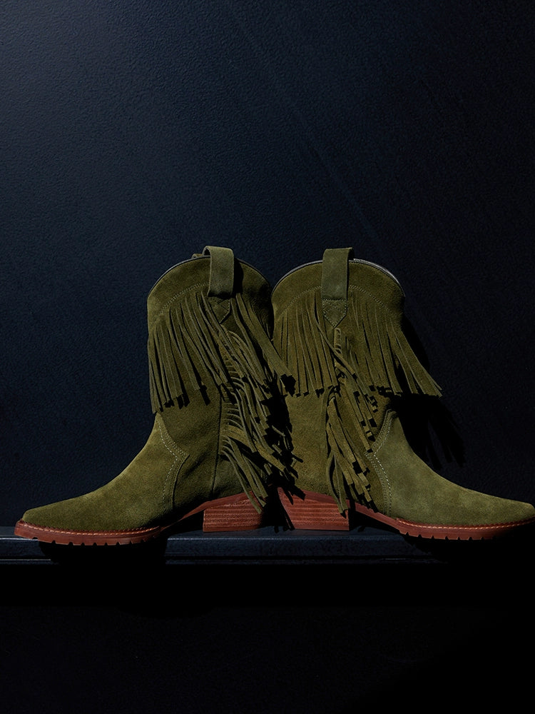 Cowboy boot with fringe detailing and a brown stacked heel