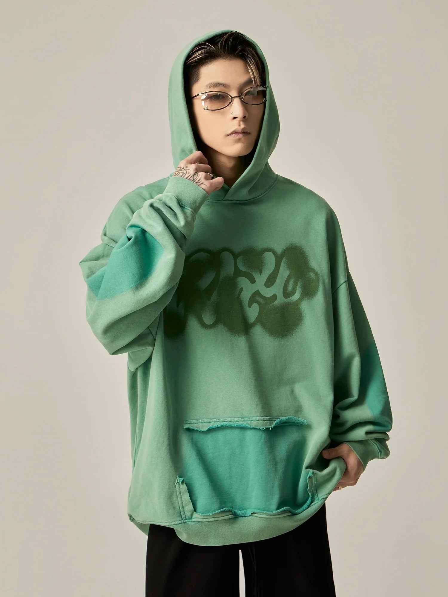 Oversized Mint Green Graffiti Hoodie with Distressed Details