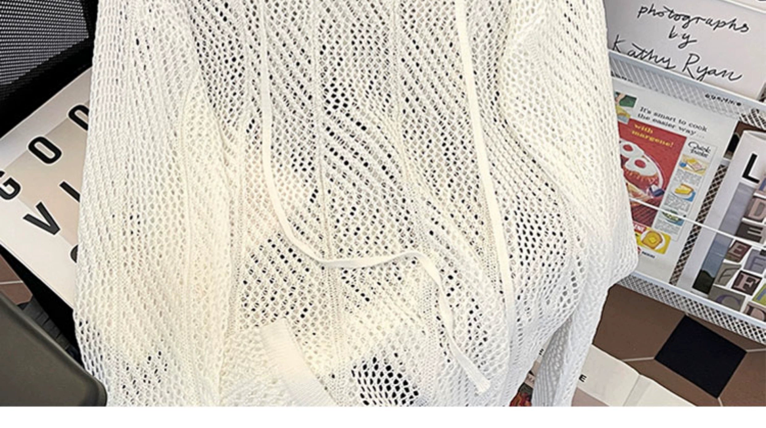 Oversized mesh knit sweater with a drawstring neckline
