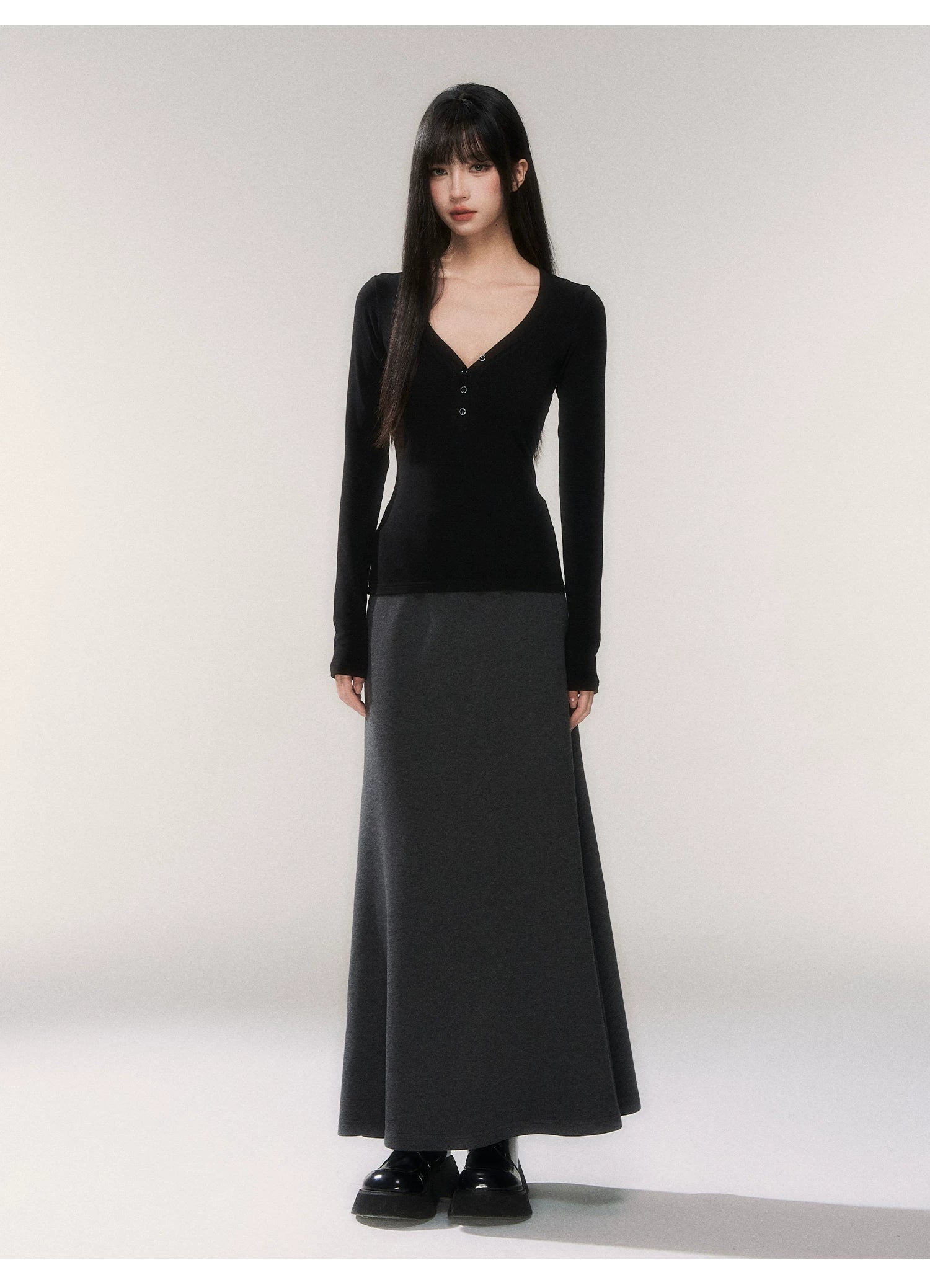 Noir Silhouette Buttoned V‑Neck Top