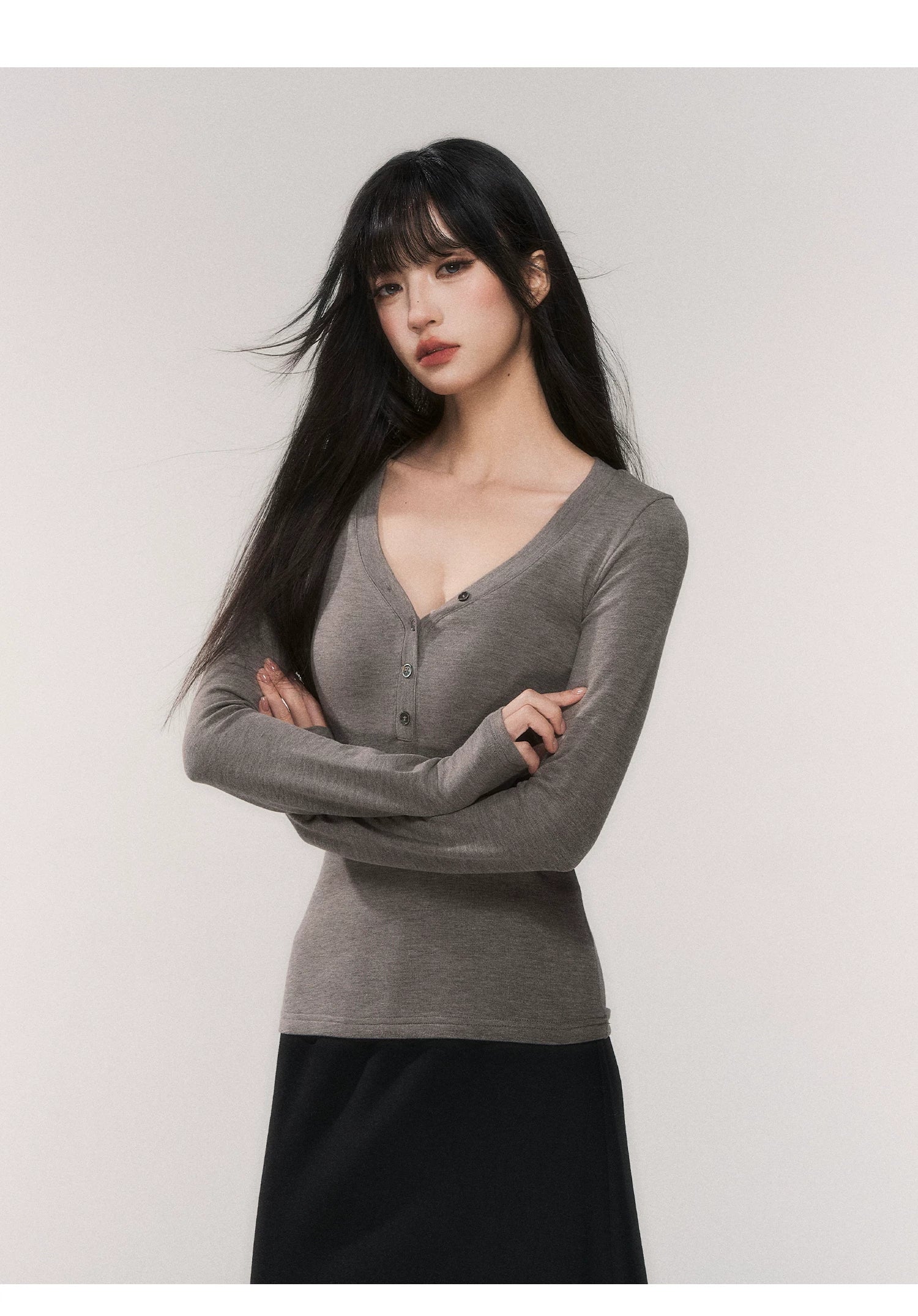 Noir Silhouette Buttoned V‑Neck Top