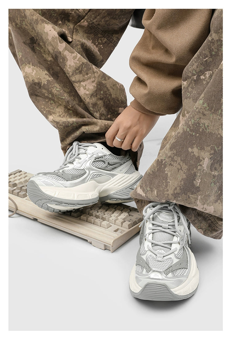 Chunky Futuristic Sneakers with Mesh Panels and Crisscross Detailing