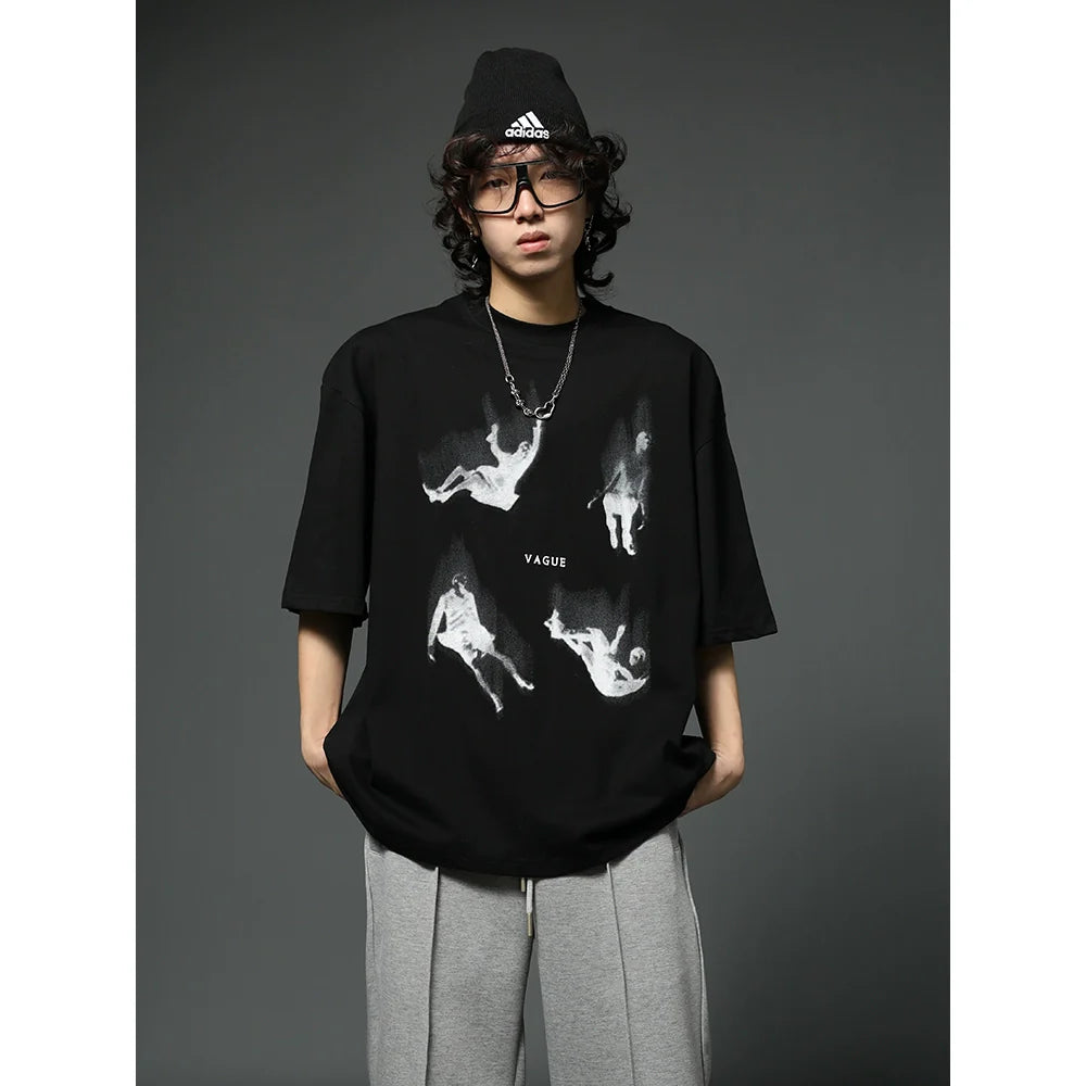 Oversized Black Graphic T-Shirt with Floating Figures Print