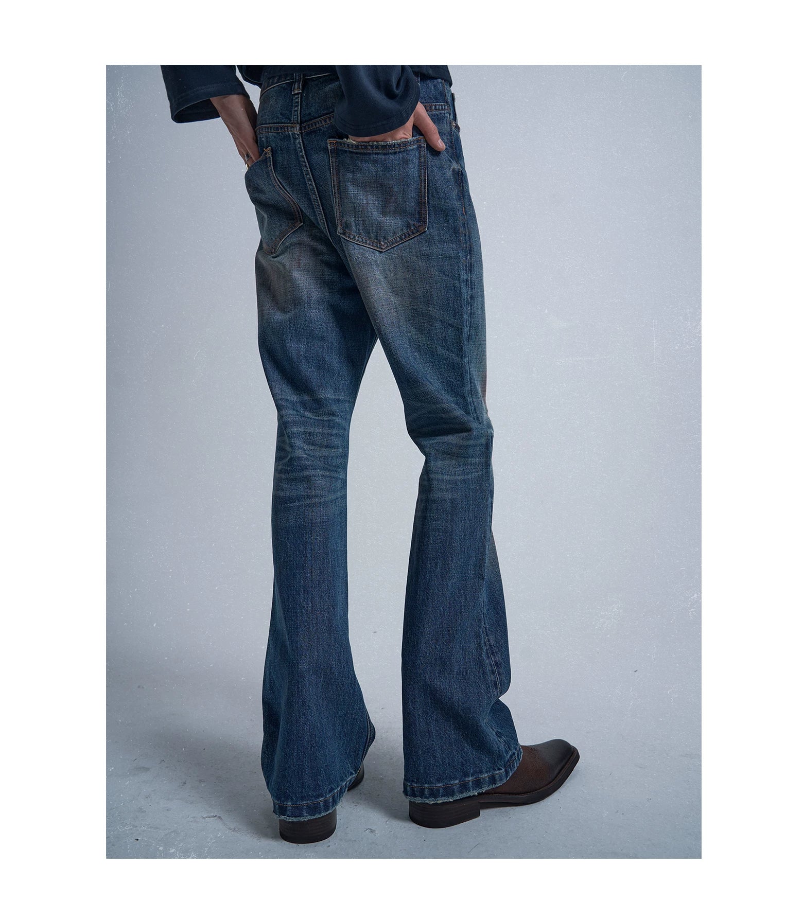 Rust‑Dyed Navy Distressed Bootcut Jeans