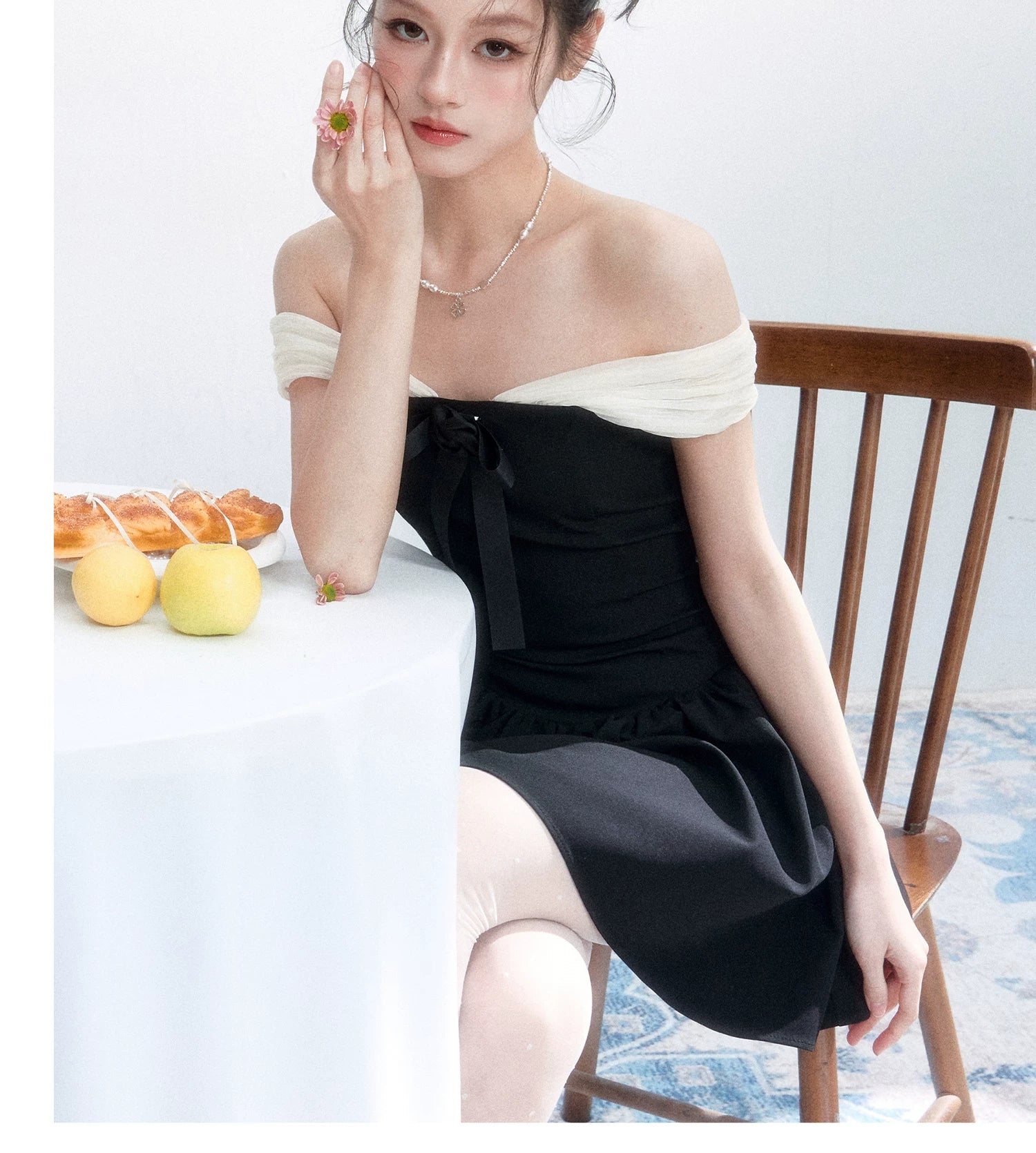 Contrast Off-Shoulder Bow Mini Dress - seated side view