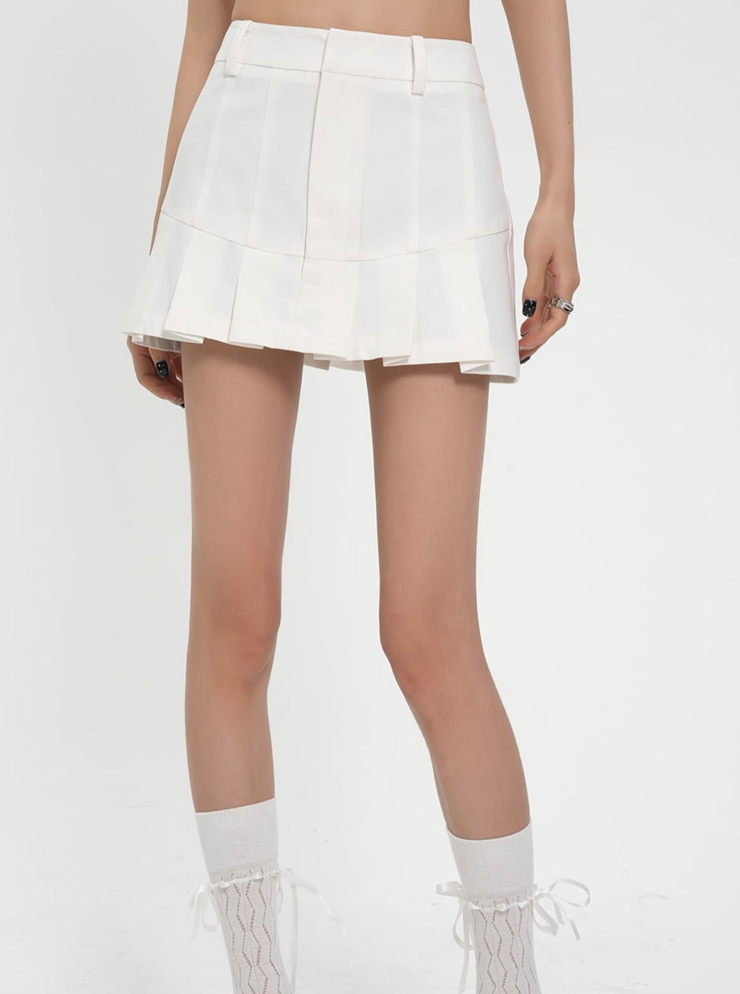 Flirty Flare Duo: Crisp White Pleated Tennis Skort & Textured Black Tiered Mini Skirt Set