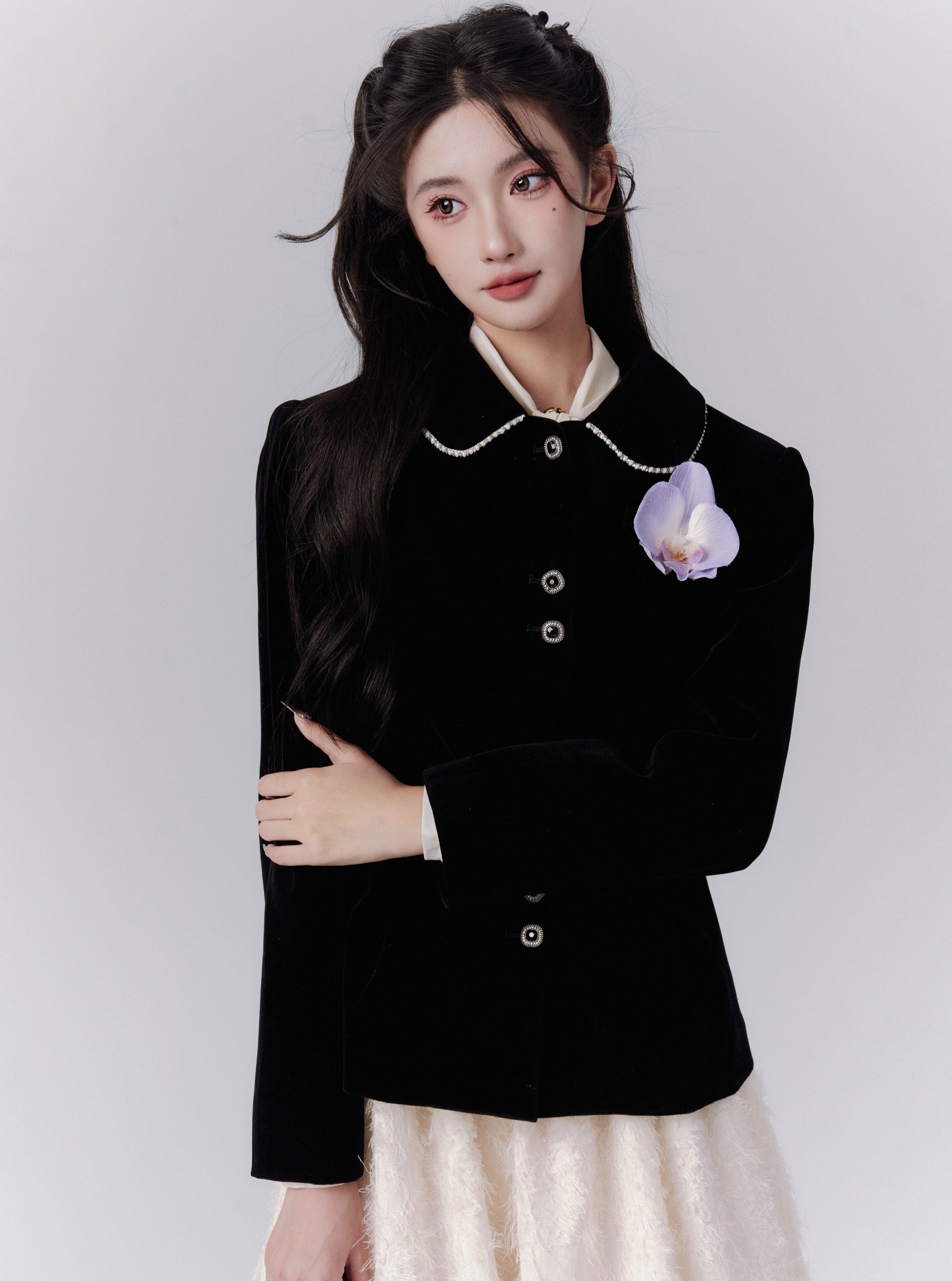 Elegant Black Fitted Blazer with Floral Brooch