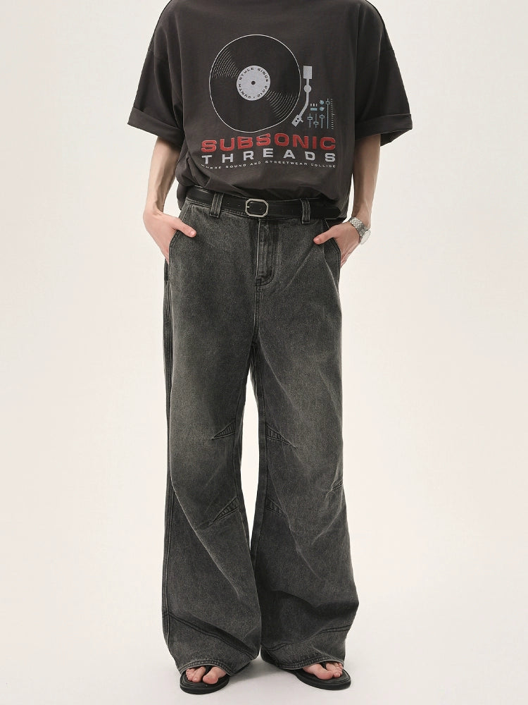 Wide-Leg Faded Distressed Jeans with Unique Seam Detailing