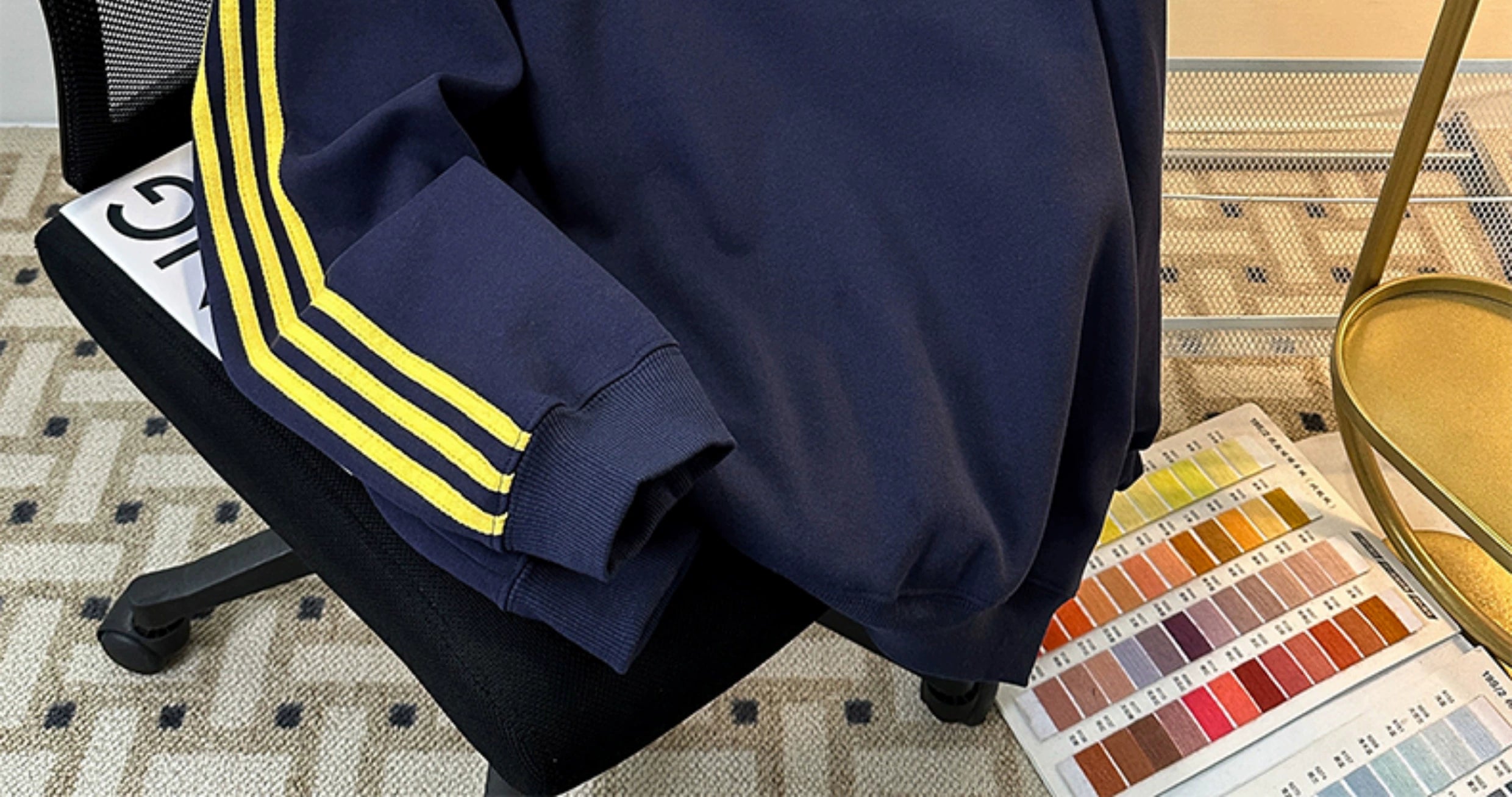 Black Track Jacket with Red Stripes and White Graphic Lettering