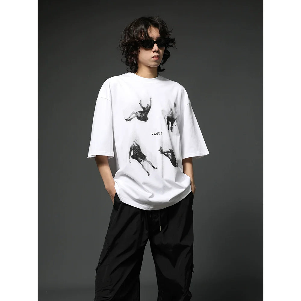 Oversized Black Graphic T-Shirt with Floating Figures Print