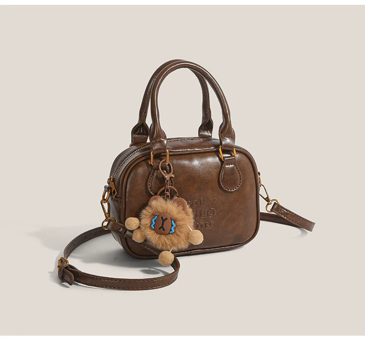 Cocoa Cub Charm Satchel