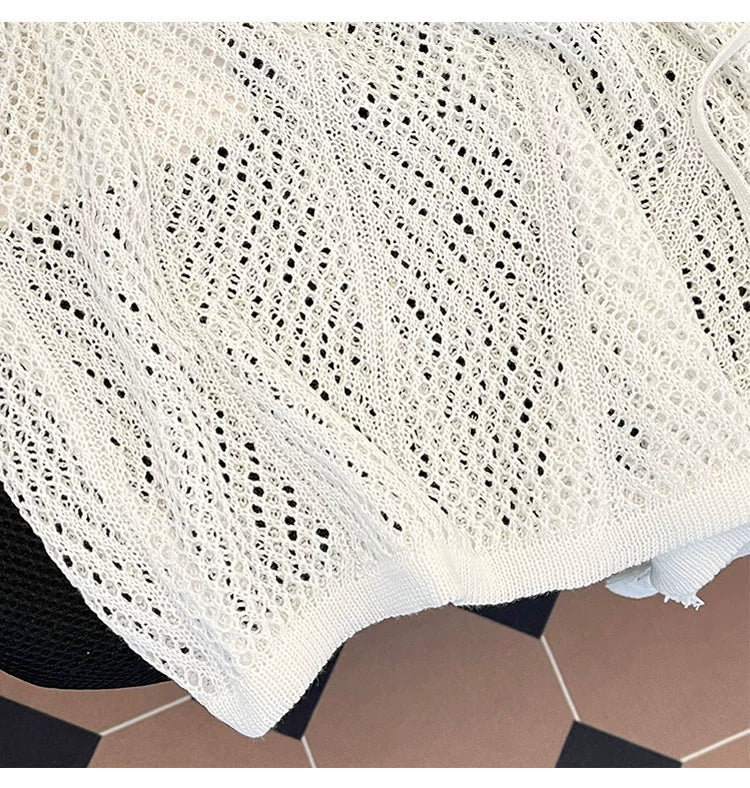 Oversized mesh knit sweater with a drawstring neckline