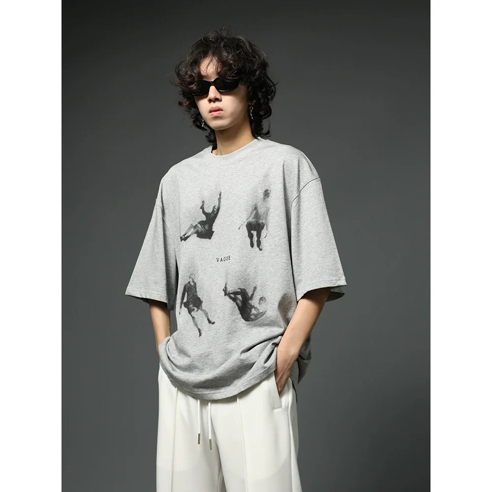 Oversized Black Graphic T-Shirt with Floating Figures Print