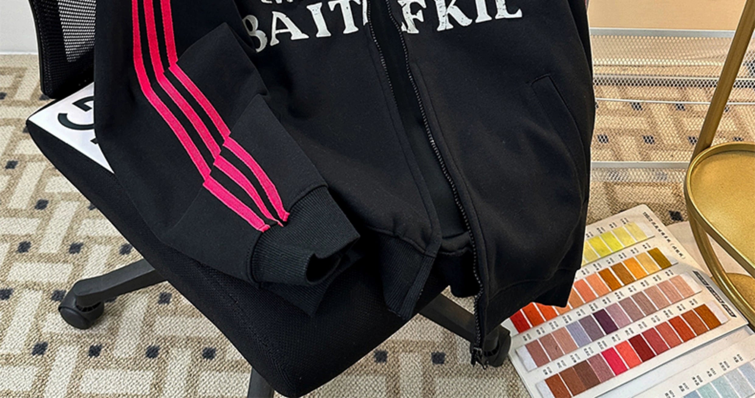 Black Track Jacket with Red Stripes and White Graphic Lettering